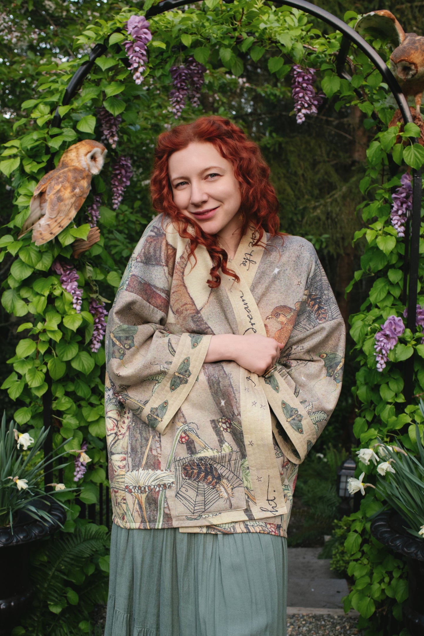 Model wearing the Lovelight Cottage Cardigan ft artwork by world-renowned illustrator Charles van Sandwyk - Market of Stars