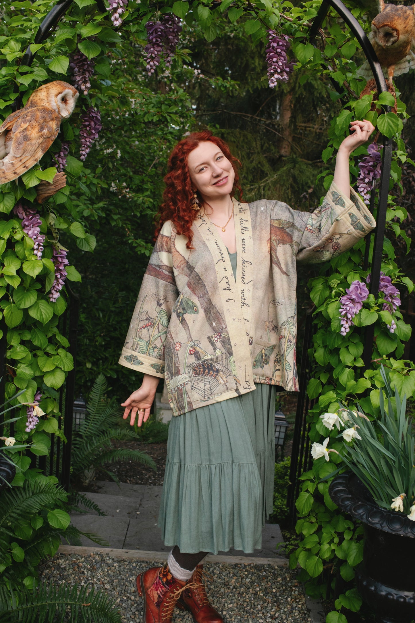 Model wearing the Lovelight Cottage Cardigan ft artwork by world-renowned illustrator Charles van Sandwyk - Market of Stars