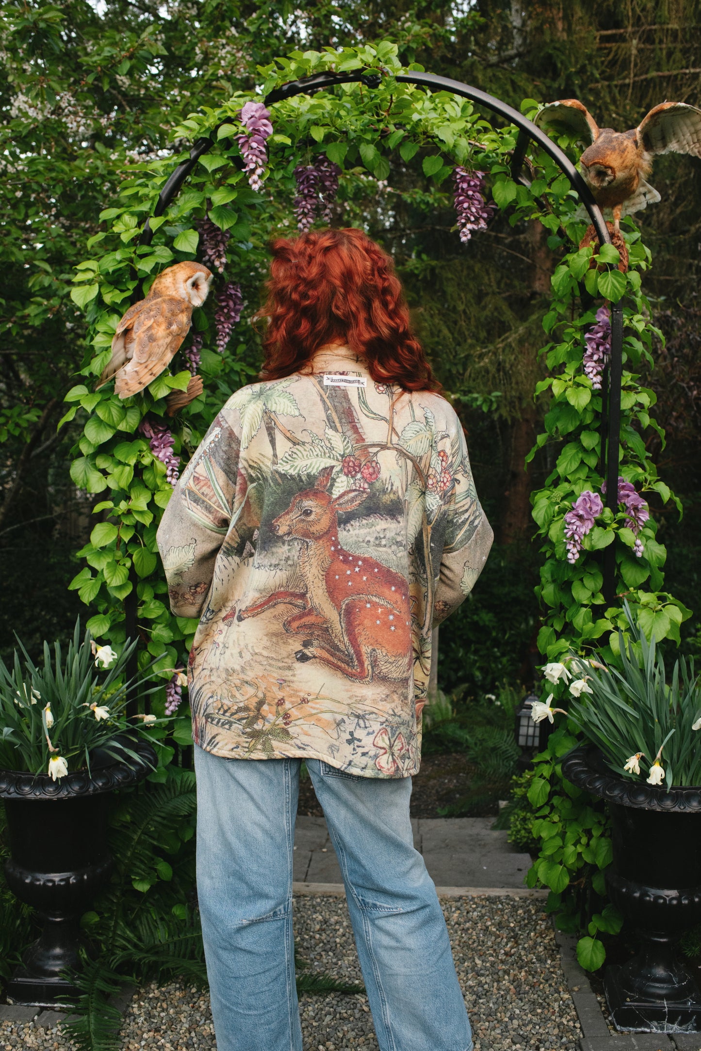 Model wearing the Lovelight Cottage Cardigan ft artwork by world-renowned illustrator Charles van Sandwyk - Market of Stars