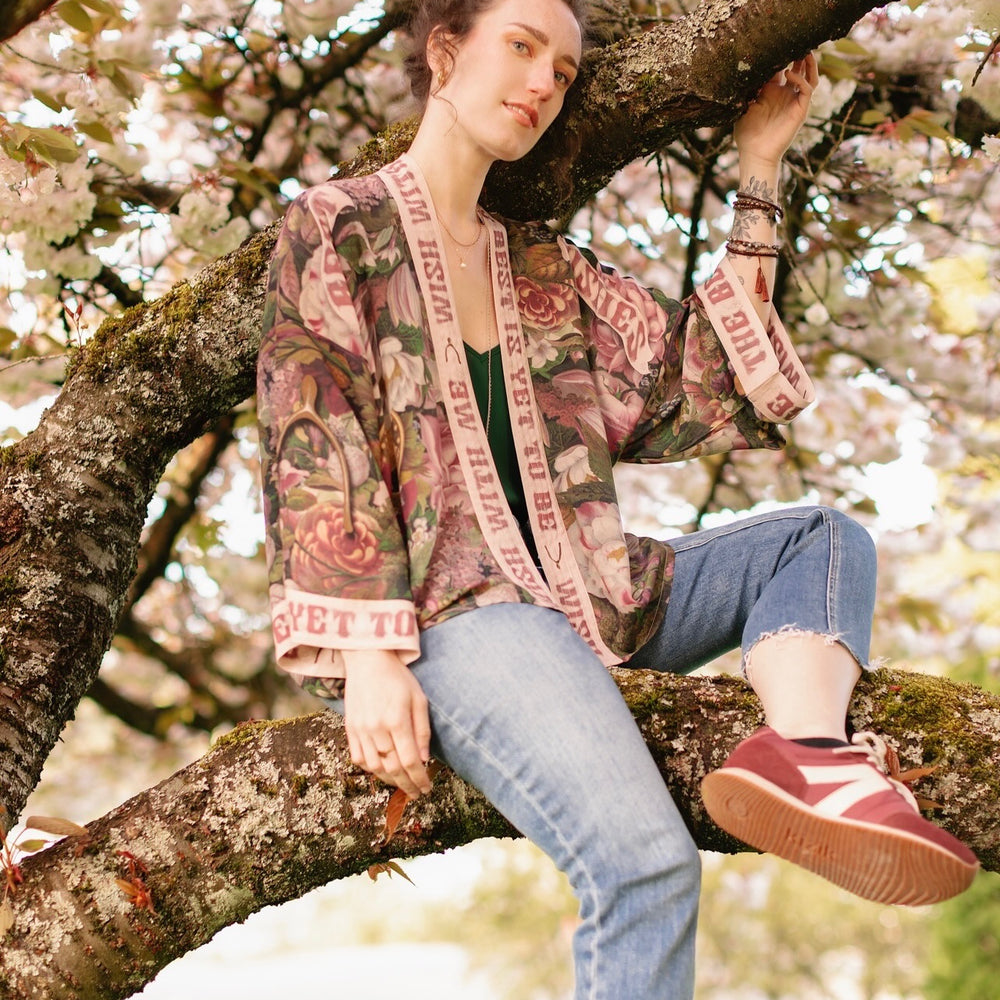 
                  
                    Model wearing cropped kimono featuring gold wishbone–vintage coin–evening star–dandelion–and spring floral collage with “Make a wish” banner – Market of Stars
                  
                