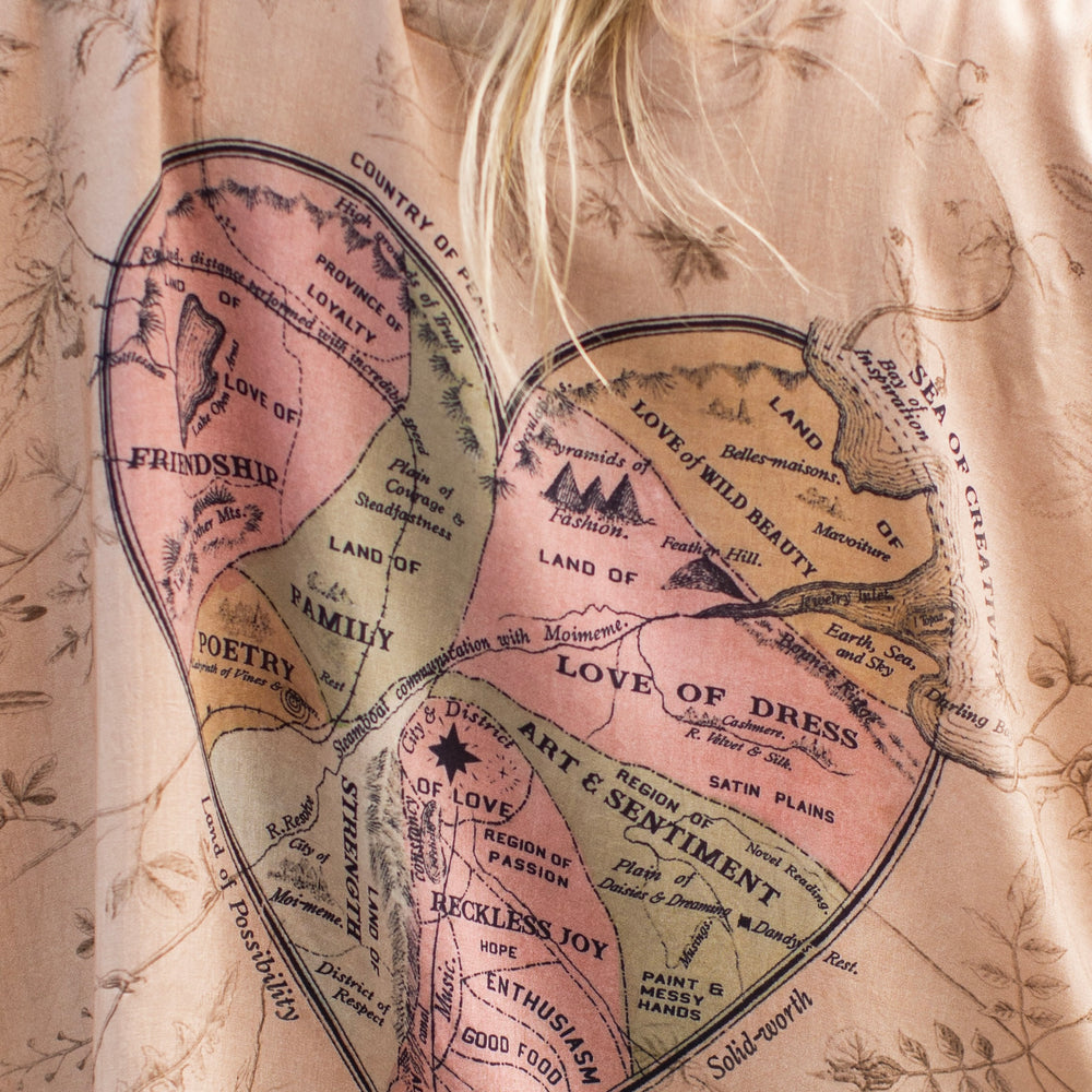 
                  
                    Model wearing map print kimono featuring a reimagined 1846 artwork titled A Map of the Open Country of a Woman’s Heart – Market of Stars
                  
                
