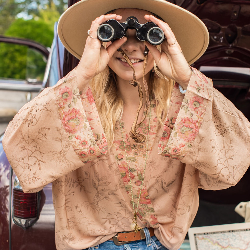 
                  
                    Model wearing map print kimono featuring a reimagined 1846 artwork titled A Map of the Open Country of a Woman’s Heart – Market of Stars
                  
                