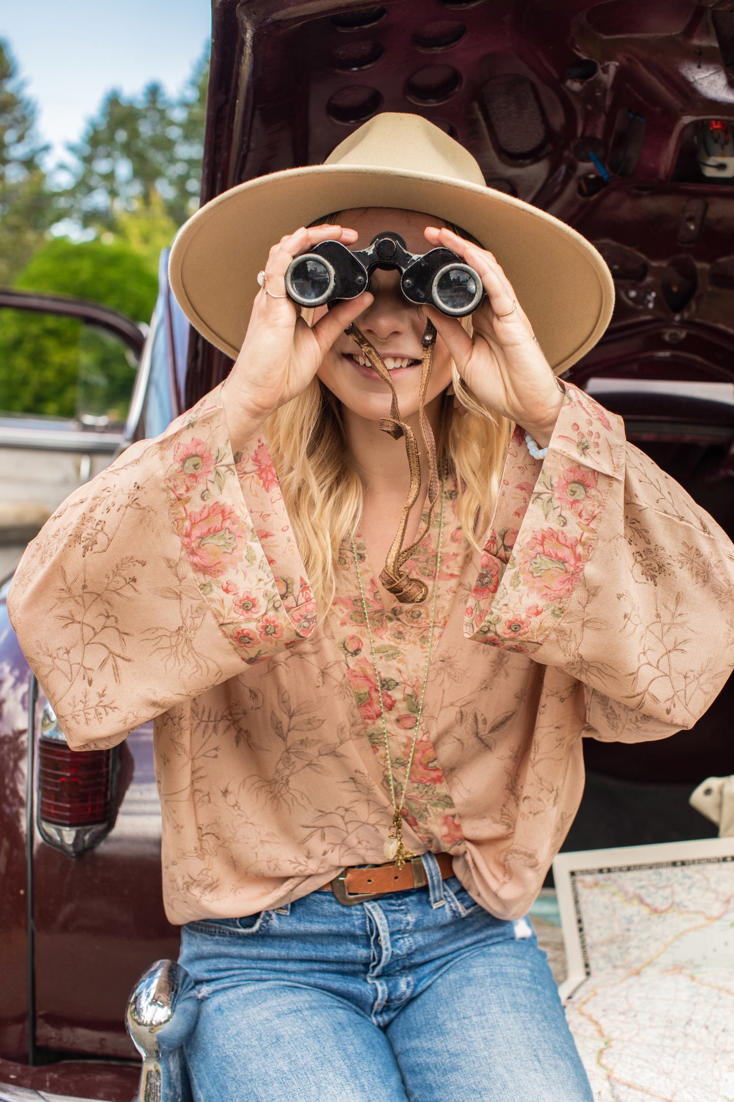 Model wearing map print kimono featuring a reimagined 1846 artwork titled A Map of the Open Country of a Woman’s Heart – Market of Stars