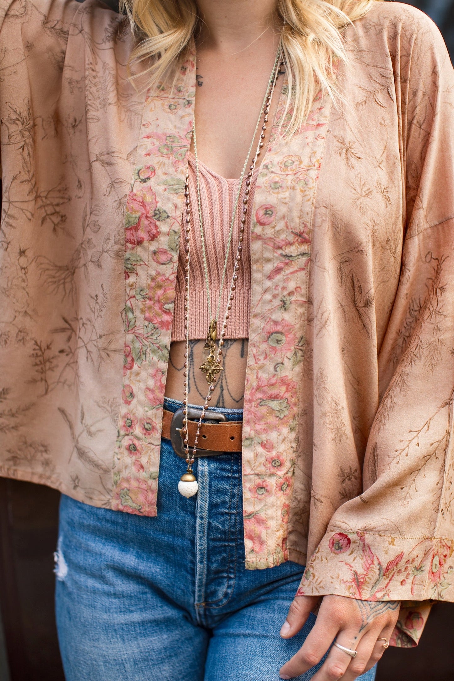 Model wearing map print kimono featuring a reimagined 1846 artwork titled A Map of the Open Country of a Woman’s Heart – Market of Stars