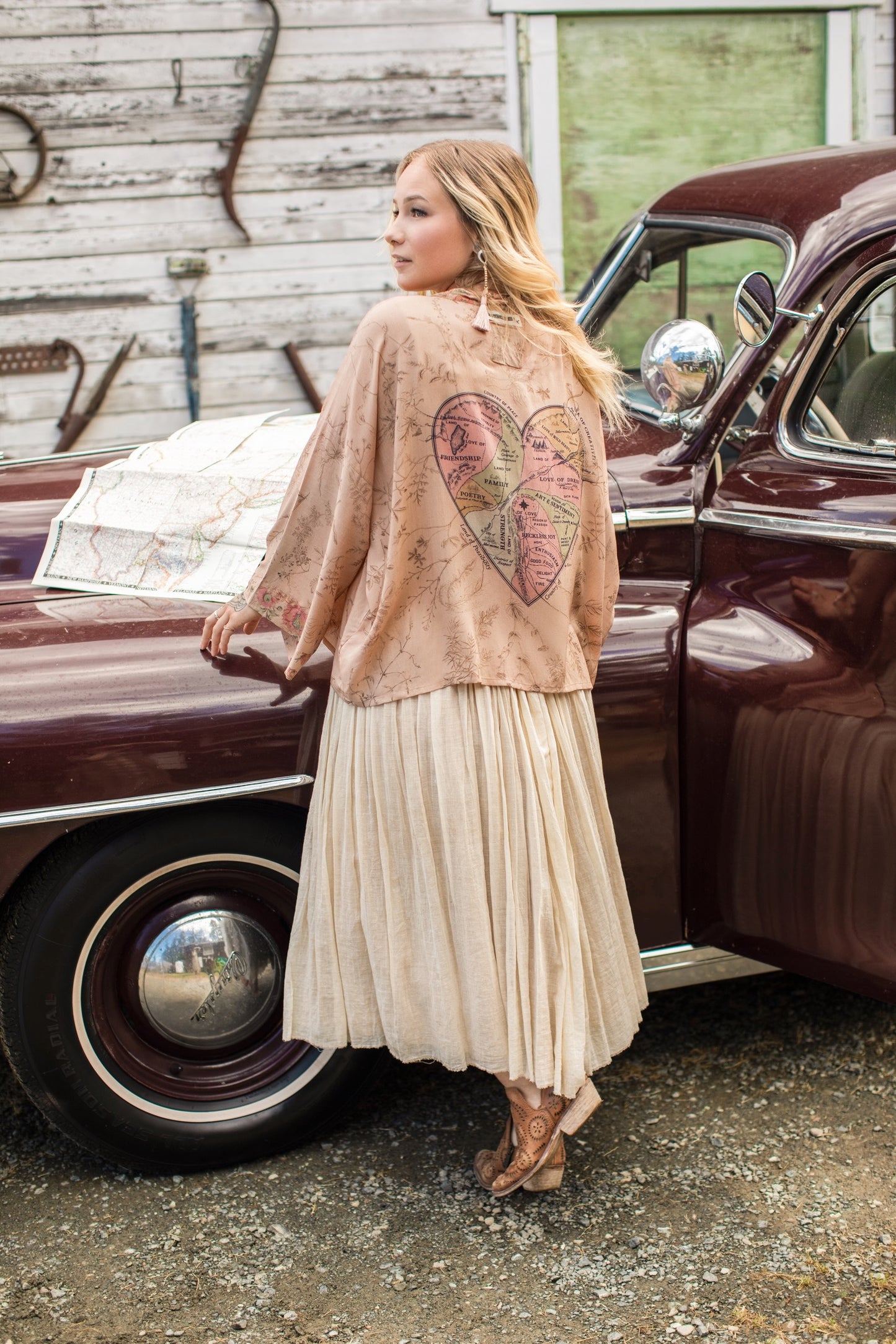 Model wearing map print kimono featuring a reimagined 1846 artwork titled A Map of the Open Country of a Woman’s Heart – Market of Stars