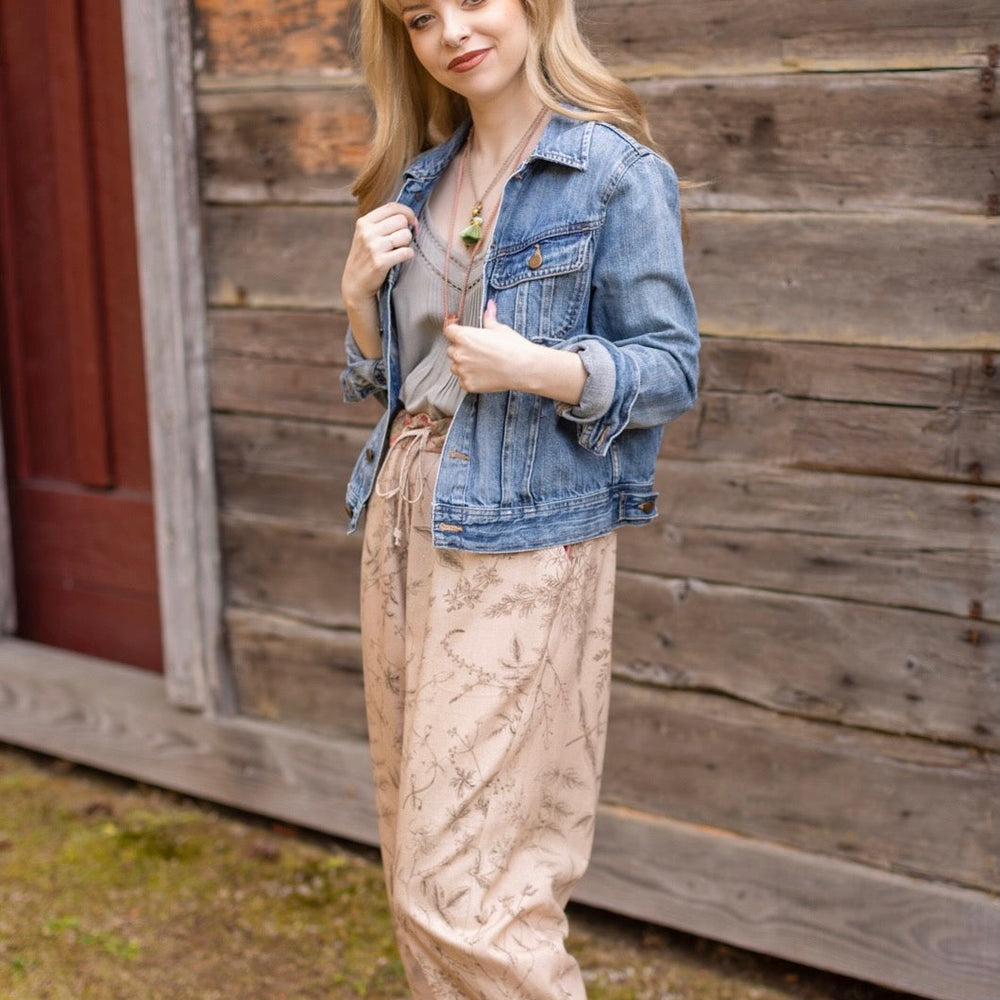 
                  
                    Model wearing artist pants in oat featuring reimagined vintage 1846 map of a woman’s heart with playful updated place names – Market of Stars
                  
                