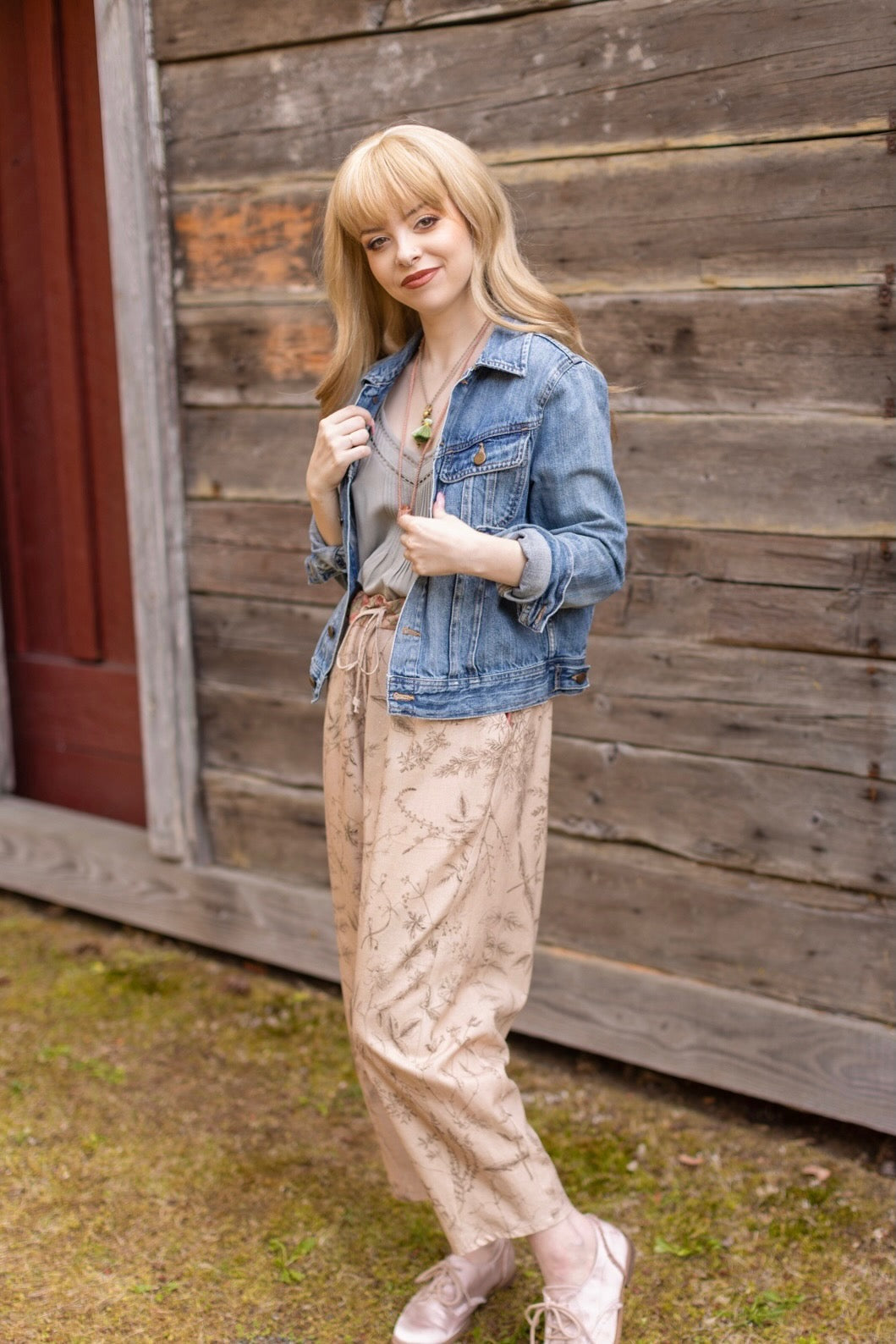 Model wearing artist pants in oat featuring reimagined vintage 1846 map of a woman’s heart with playful updated place names – Market of Stars
