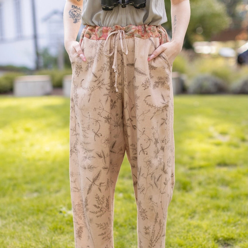 
                  
                    Model wearing artist pants in oat featuring reimagined vintage 1846 map of a woman’s heart with playful updated place names – Market of Stars
                  
                