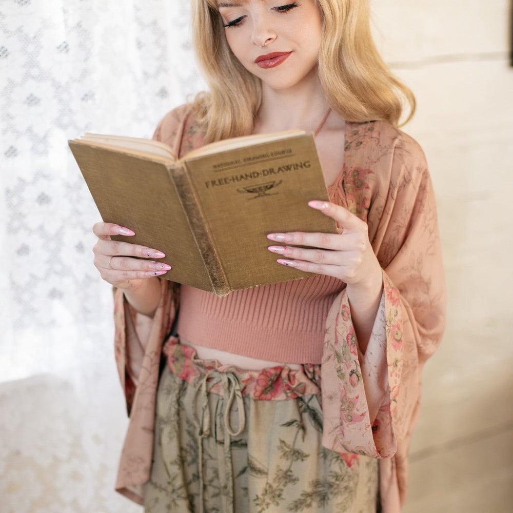
                  
                    Model wearing artist pants in sage featuring reimagined vintage 1846 map of a woman’s heart with playful updated place names – Market of Stars
                  
                