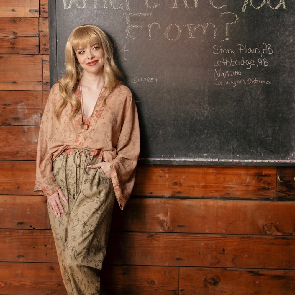 
                  
                    Model wearing artist pants in sage featuring reimagined vintage 1846 map of a woman’s heart with playful updated place names – Market of Stars
                  
                
