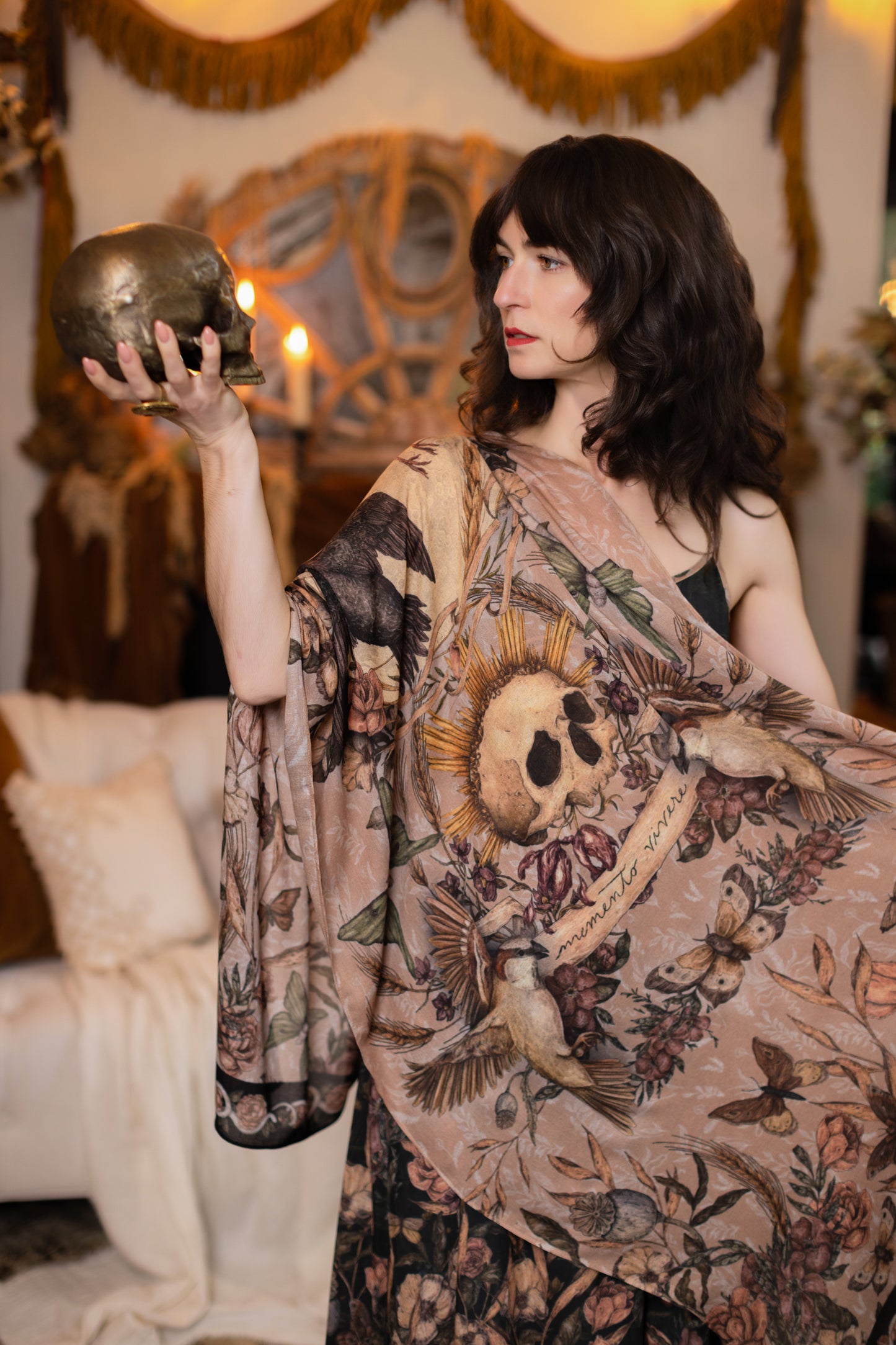 Model wearing a bamboo-viscose scarf ft. artwork created by Jessica Roux including two starlings beneath a full moon with flowers, butterflies, moths and botanical artwork - Market of Stars