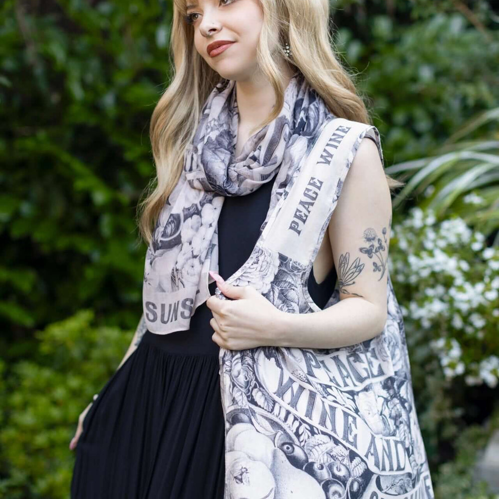 
                  
                    Model wearing a linen tote bag for everyday adventures with a whimsical print celebrating life's simple pleasures - Market of Stars
                  
                