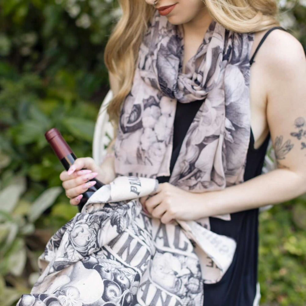 
                  
                    Model wearing a linen tote bag for everyday adventures with a whimsical print celebrating life's simple pleasures - Market of Stars
                  
                