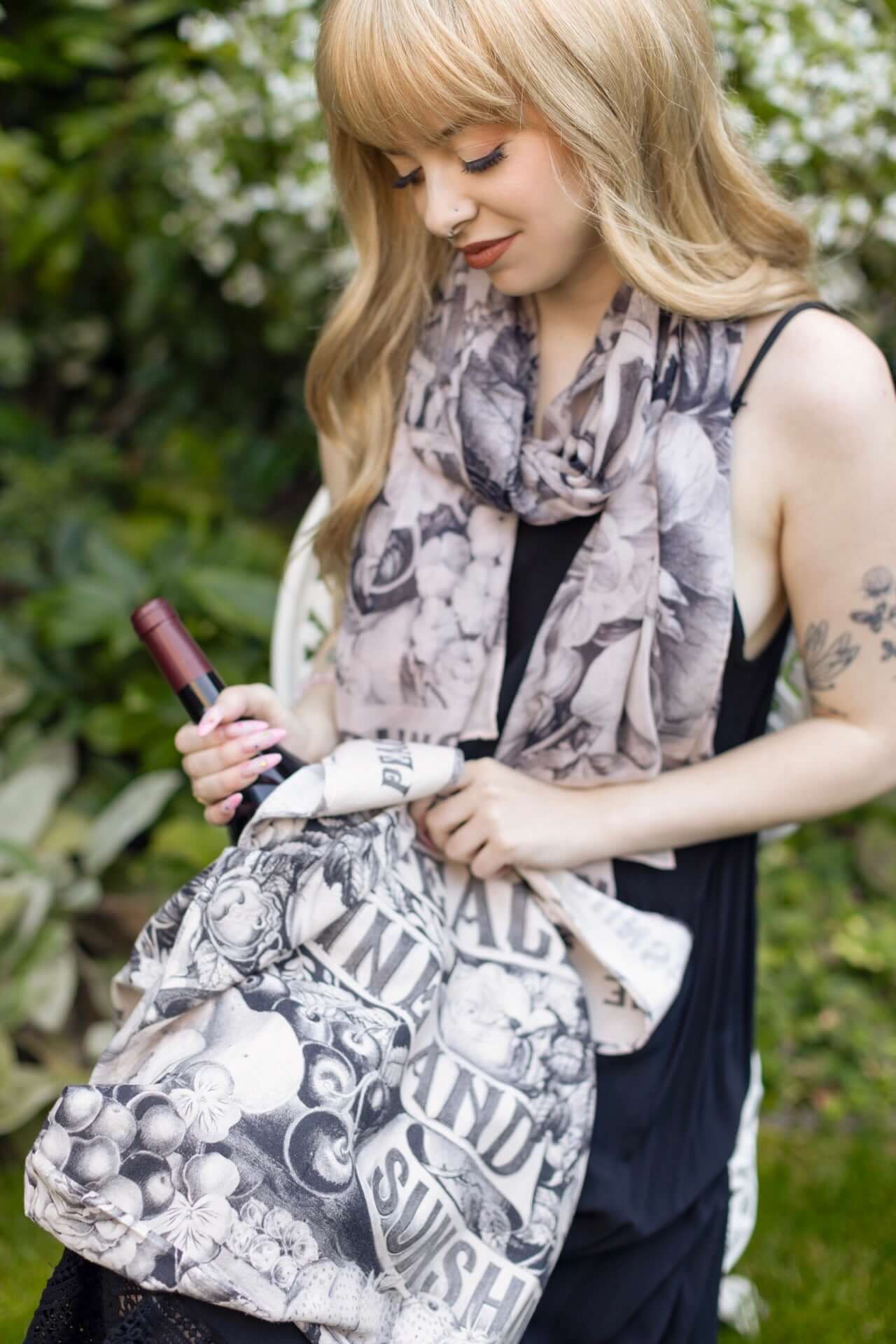 Model wearing a linen tote bag for everyday adventures with a whimsical print celebrating life's simple pleasures - Market of Stars