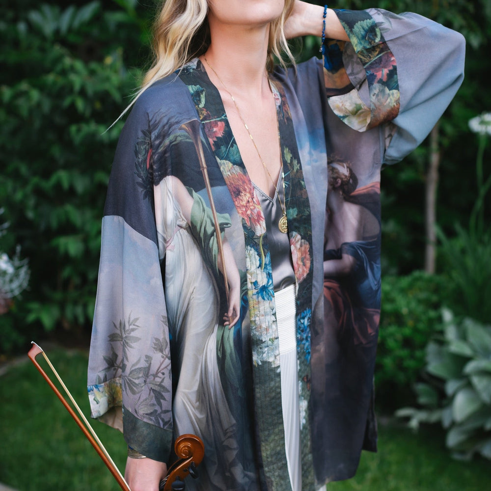 
                  
                    Model wearing Peace, Wine & Sunshine Bohéme Slip Dress featuring botanical collages and playful peace, wine and sunshine lettering on the hem – Market of Stars.
                  
                