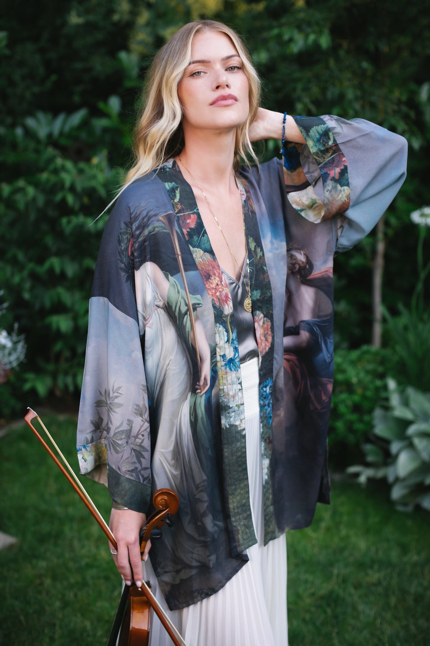 Model wearing Peace, Wine & Sunshine Bohéme Slip Dress featuring botanical collages and playful peace, wine and sunshine lettering on the hem – Market of Stars.