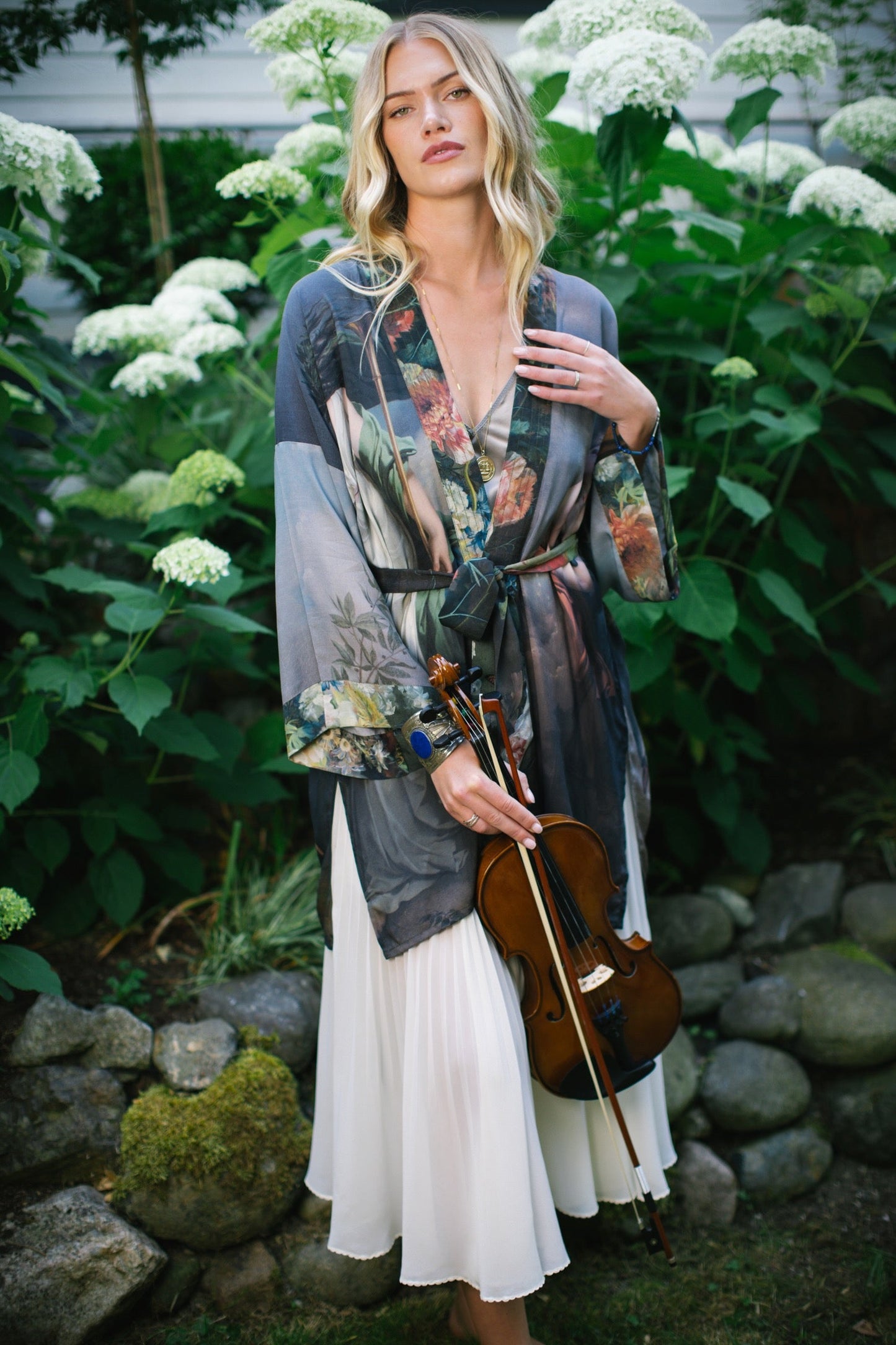 Model wearing Peace, Wine & Sunshine Bohéme Slip Dress featuring botanical collages and playful peace, wine and sunshine lettering on the hem – Market of Stars.