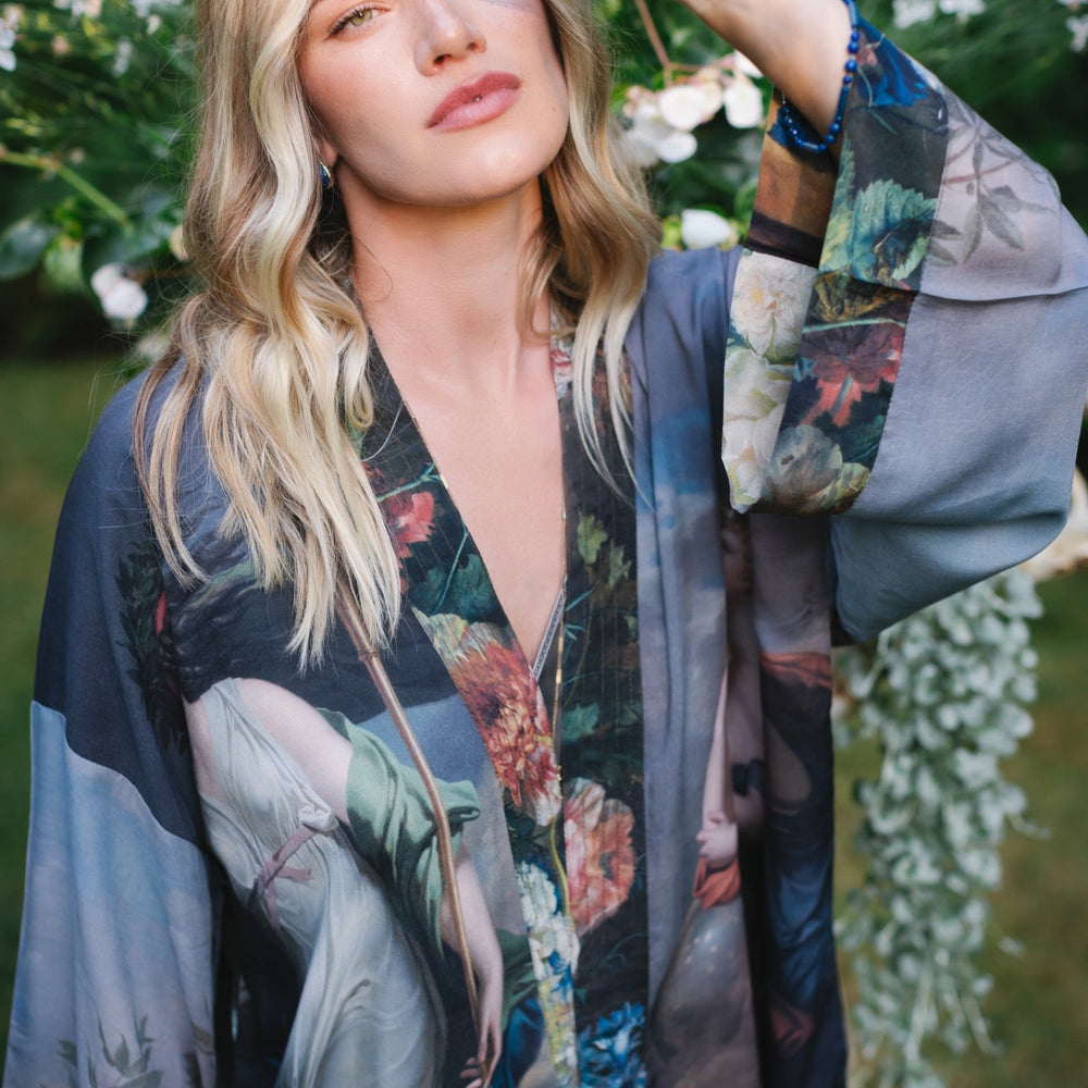 
                  
                    Model wearing Peace, Wine & Sunshine Bohéme Slip Dress featuring botanical collages and playful peace, wine and sunshine lettering on the hem – Market of Stars.
                  
                