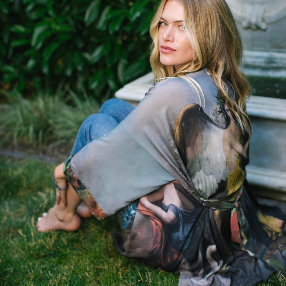 
                  
                    Model wearing Peace, Wine & Sunshine Bohéme Slip Dress featuring botanical collages and playful peace, wine and sunshine lettering on the hem – Market of Stars.
                  
                