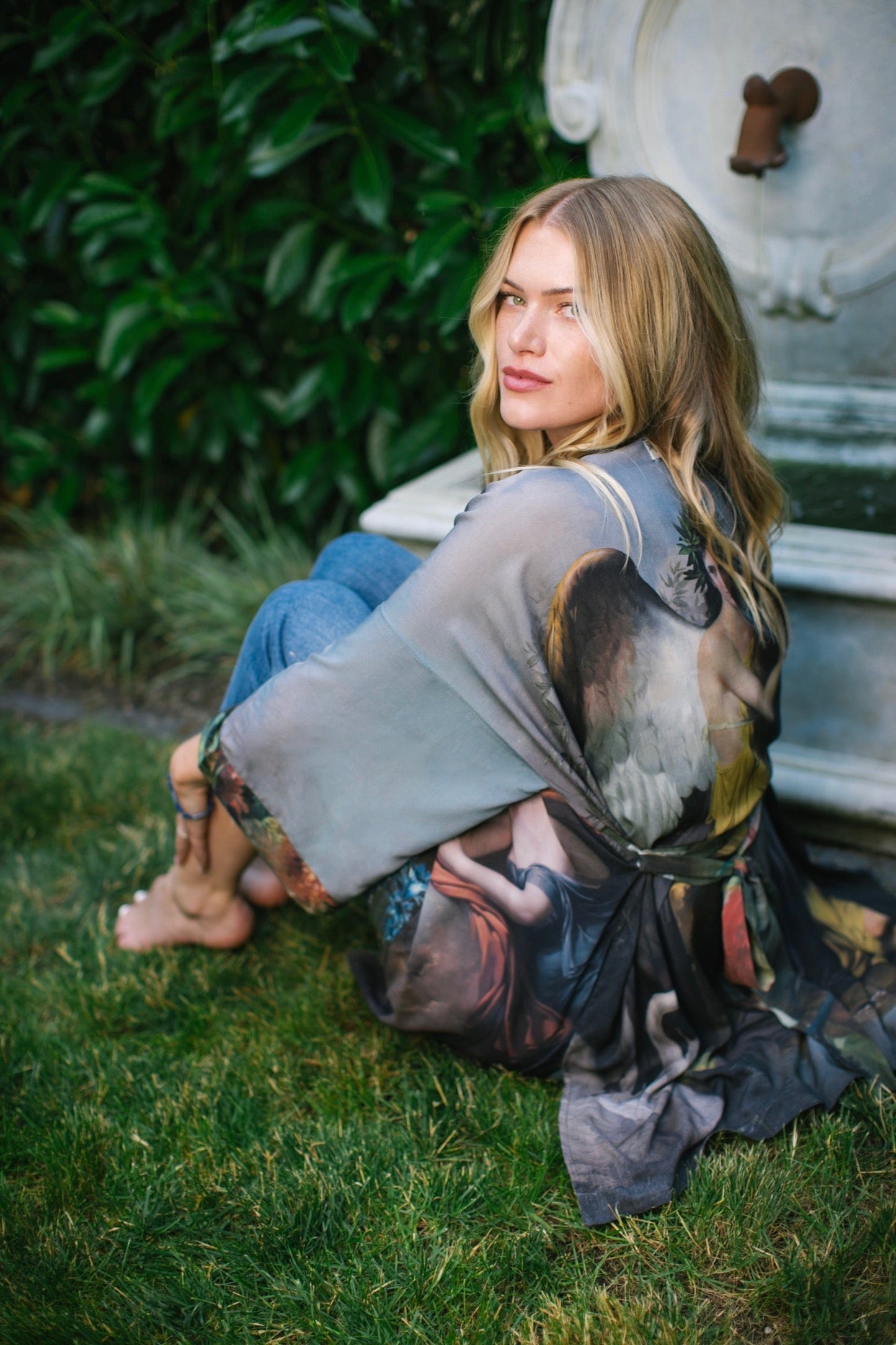 Model wearing Peace, Wine & Sunshine Bohéme Slip Dress featuring botanical collages and playful peace, wine and sunshine lettering on the hem – Market of Stars.