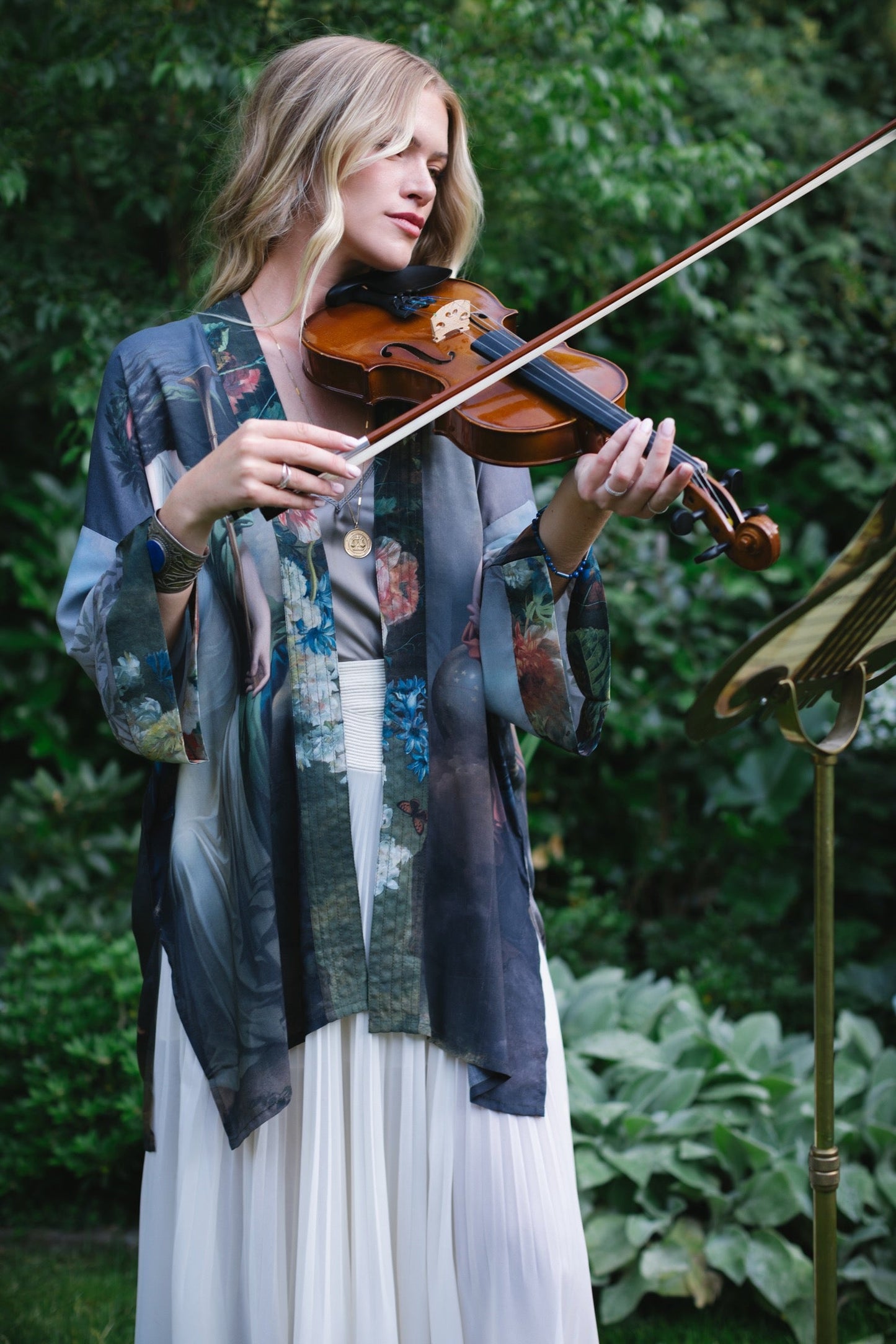 Model wearing Peace, Wine & Sunshine Bohéme Slip Dress featuring botanical collages and playful peace, wine and sunshine lettering on the hem – Market of Stars.