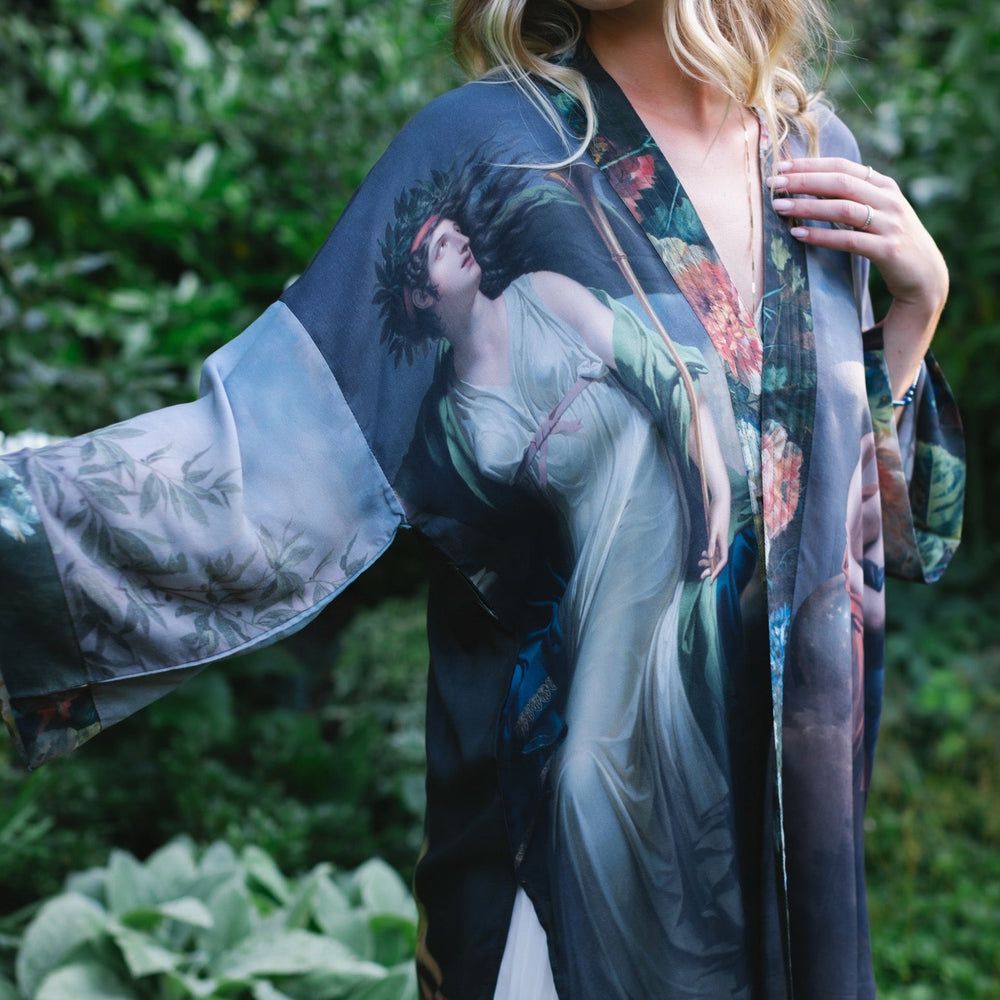 
                  
                    Model wearing Peace, Wine & Sunshine Bohéme Slip Dress featuring botanical collages and playful peace, wine and sunshine lettering on the hem – Market of Stars.
                  
                
