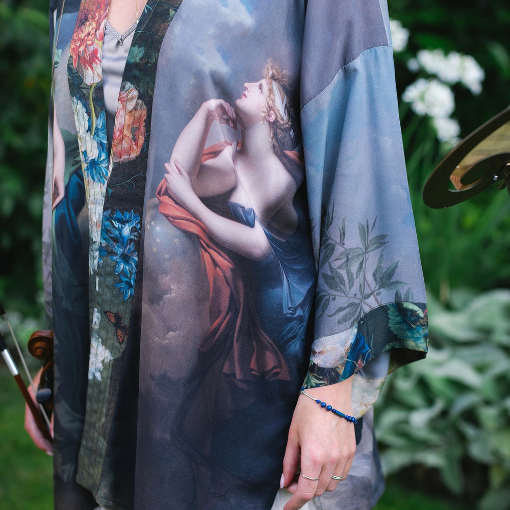 
                  
                    Model wearing Peace, Wine & Sunshine Bohéme Slip Dress featuring botanical collages and playful peace, wine and sunshine lettering on the hem – Market of Stars.
                  
                