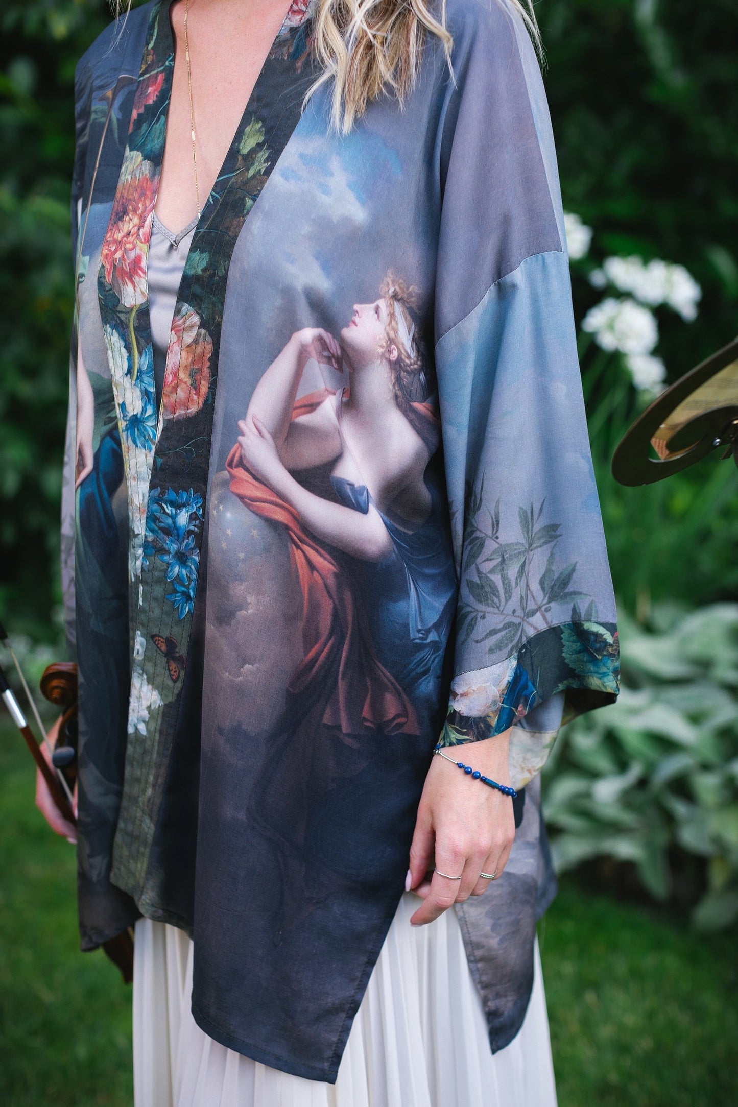 Model wearing Peace, Wine & Sunshine Bohéme Slip Dress featuring botanical collages and playful peace, wine and sunshine lettering on the hem – Market of Stars.