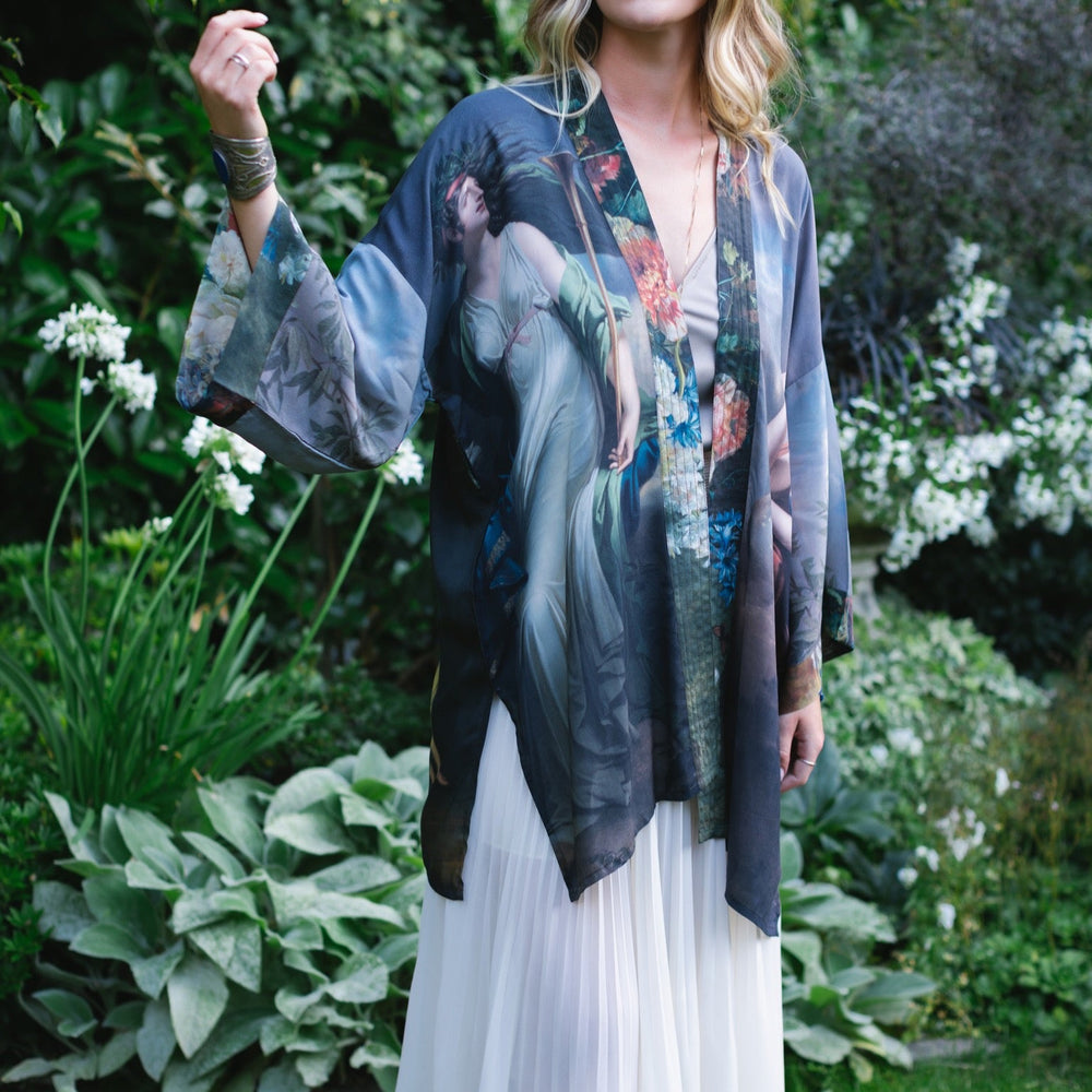 
                  
                    Model wearing Peace, Wine & Sunshine Bohéme Slip Dress featuring botanical collages and playful peace, wine and sunshine lettering on the hem – Market of Stars.
                  
                