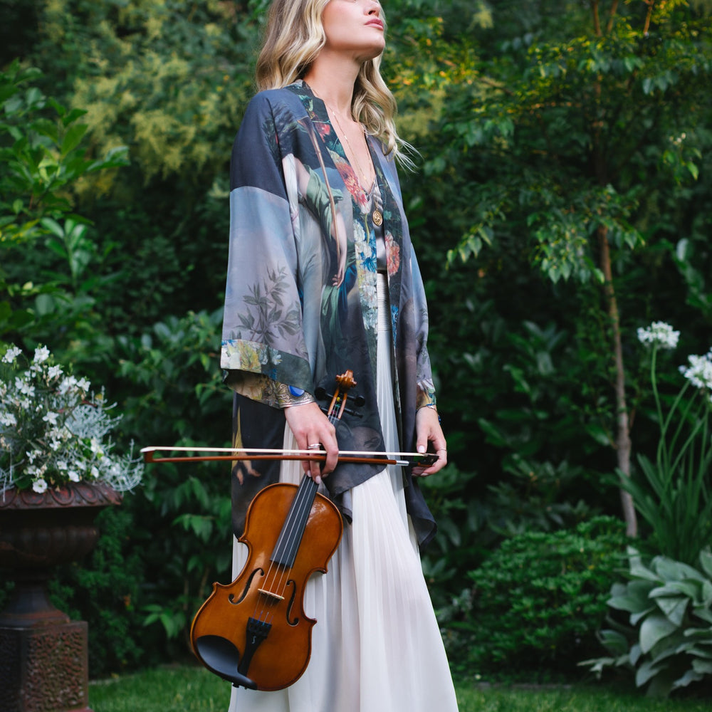 
                  
                    Model wearing Peace, Wine & Sunshine Bohéme Slip Dress featuring botanical collages and playful peace, wine and sunshine lettering on the hem – Market of Stars.
                  
                