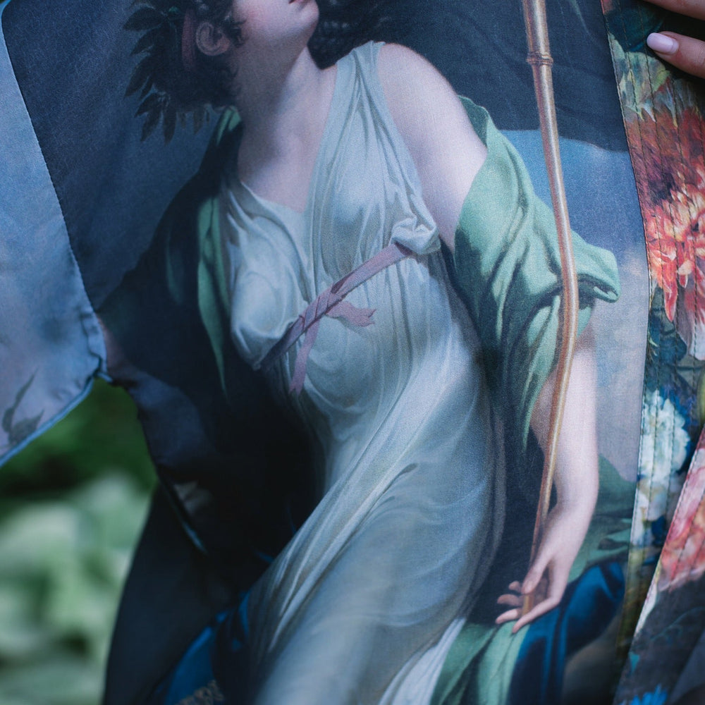 
                  
                    Model wearing Peace, Wine & Sunshine Bohéme Slip Dress featuring botanical collages and playful peace, wine and sunshine lettering on the hem – Market of Stars.
                  
                
