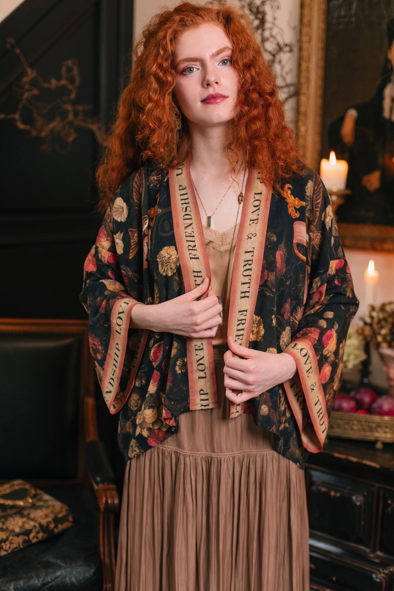 Model wearing a cropped-length bamboo-viscose duster featuring a collage of antique artwork with romance, loyalty, and old-world beauty - Market of Stars