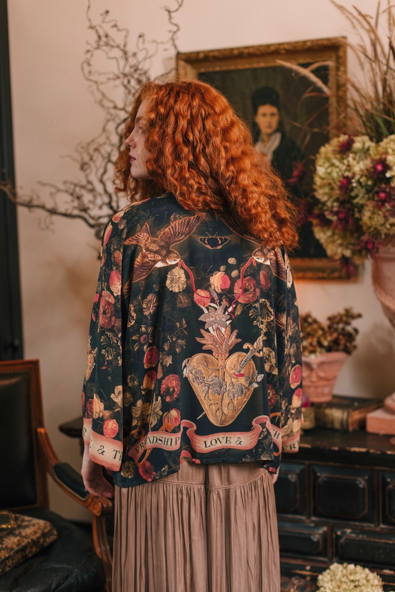 Model wearing a cropped-length bamboo-viscose duster featuring a collage of antique artwork with romance, loyalty, and old-world beauty - Market of Stars