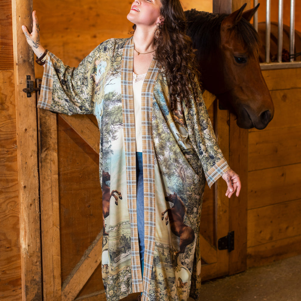 
                  
                    Model wearing a bamboo-viscose kimono duster robe made for everyday adventures with a whimsical print celebrating one's unbridled spirit of adventure - Market of Stars
                  
                