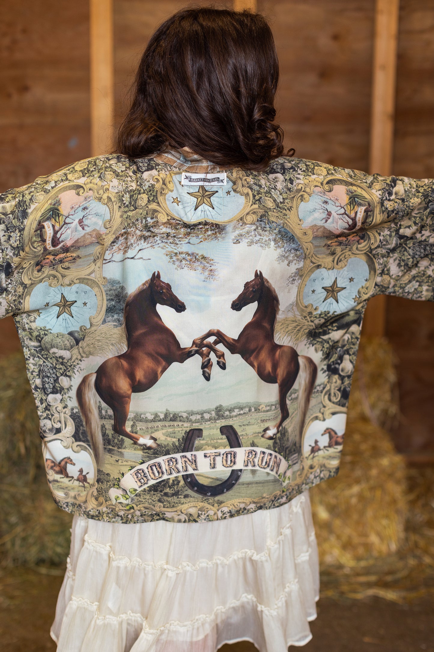 Model wearing a bamboo-viscose cropped kimono duster made for everyday adventures with a whimsical print celebrating one's unbridled spirit of adventure - Market of Stars