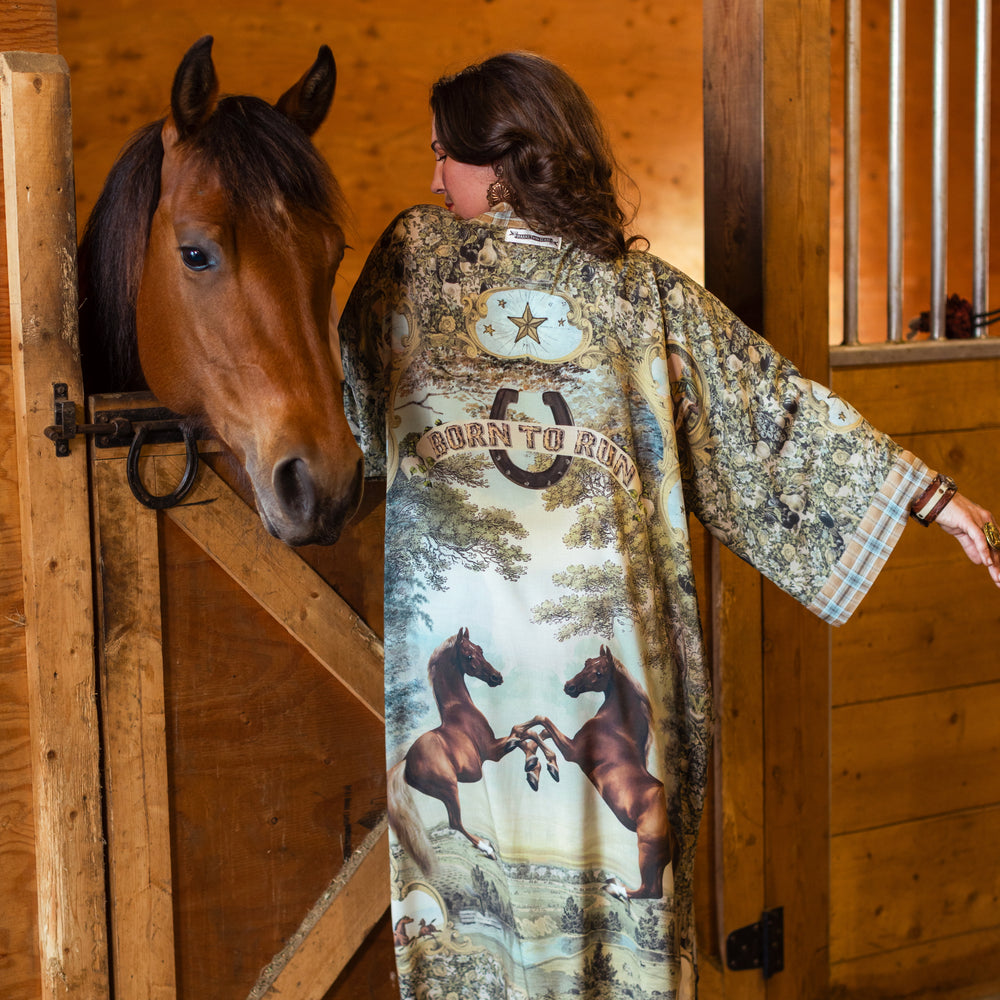 
                  
                    Model wearing a bamboo-viscose kimono duster robe made for everyday adventures with a whimsical print celebrating one's unbridled spirit of adventure - Market of Stars
                  
                