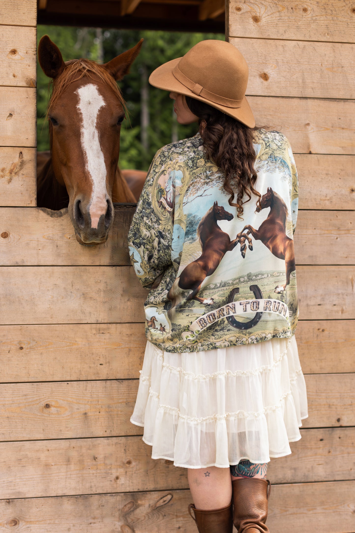 Model wearing a bamboo-viscose cropped kimono duster made for everyday adventures with a whimsical print celebrating one's unbridled spirit of adventure - Market of Stars