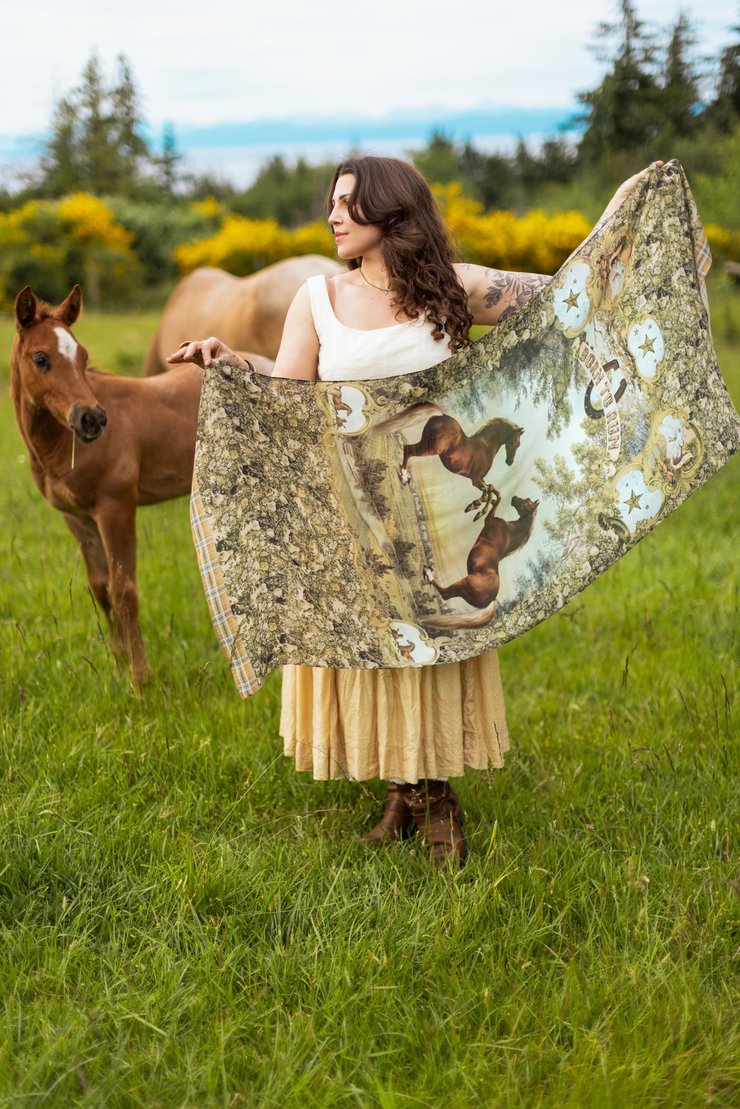 Model wearing a bamboo-viscose scarf made for everyday adventures with a whimsical print celebrating one's unbridled spirit of adventure - Market of Stars
