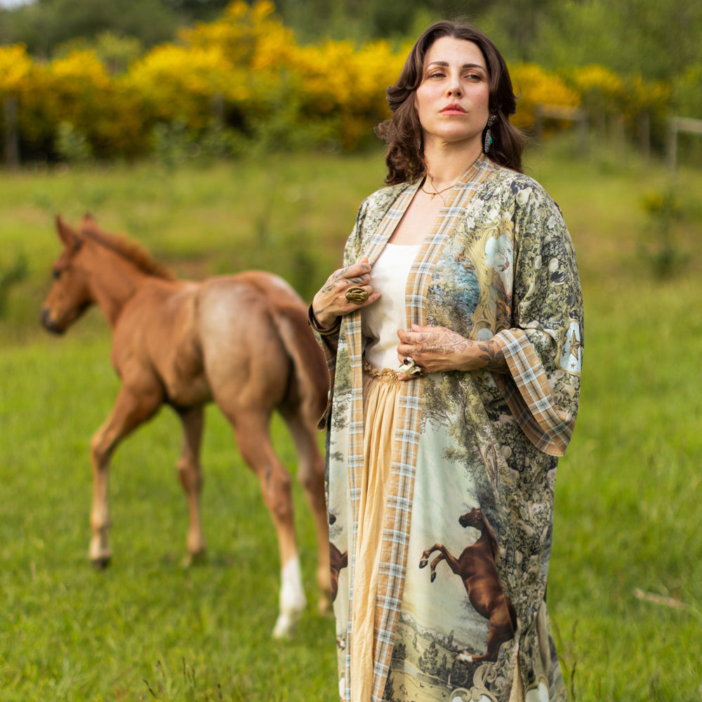 
                  
                    Model wearing a bamboo-viscose kimono duster robe made for everyday adventures with a whimsical print celebrating one's unbridled spirit of adventure - Market of Stars
                  
                