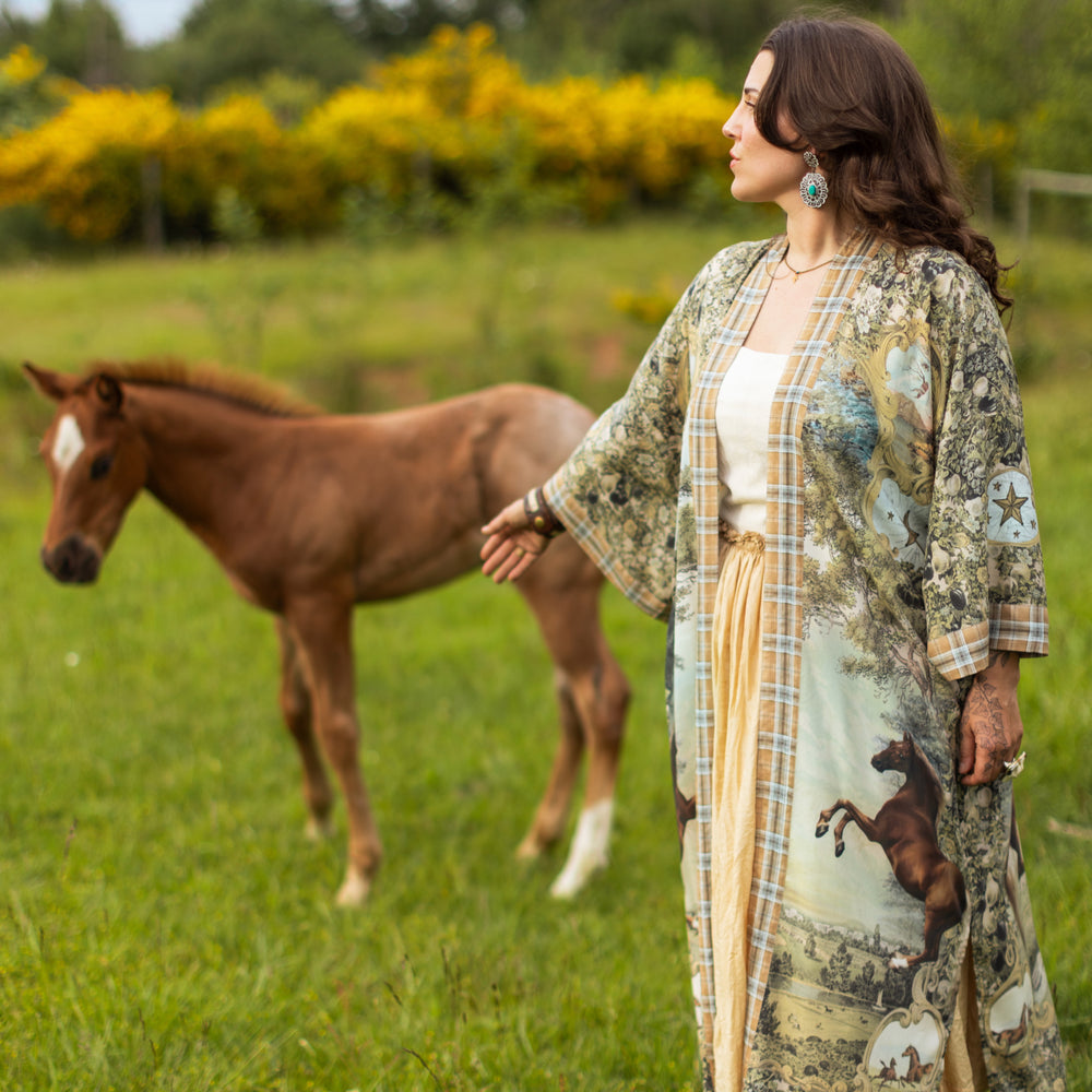 
                  
                    Model wearing a bamboo-viscose kimono duster robe made for everyday adventures with a whimsical print celebrating one's unbridled spirit of adventure - Market of Stars
                  
                