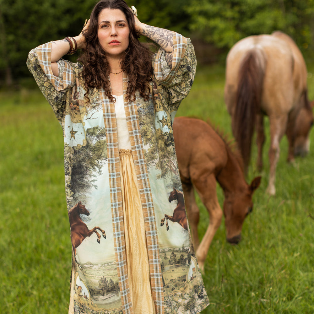 
                  
                    Model wearing a bamboo-viscose kimono duster robe made for everyday adventures with a whimsical print celebrating one's unbridled spirit of adventure - Market of Stars
                  
                
