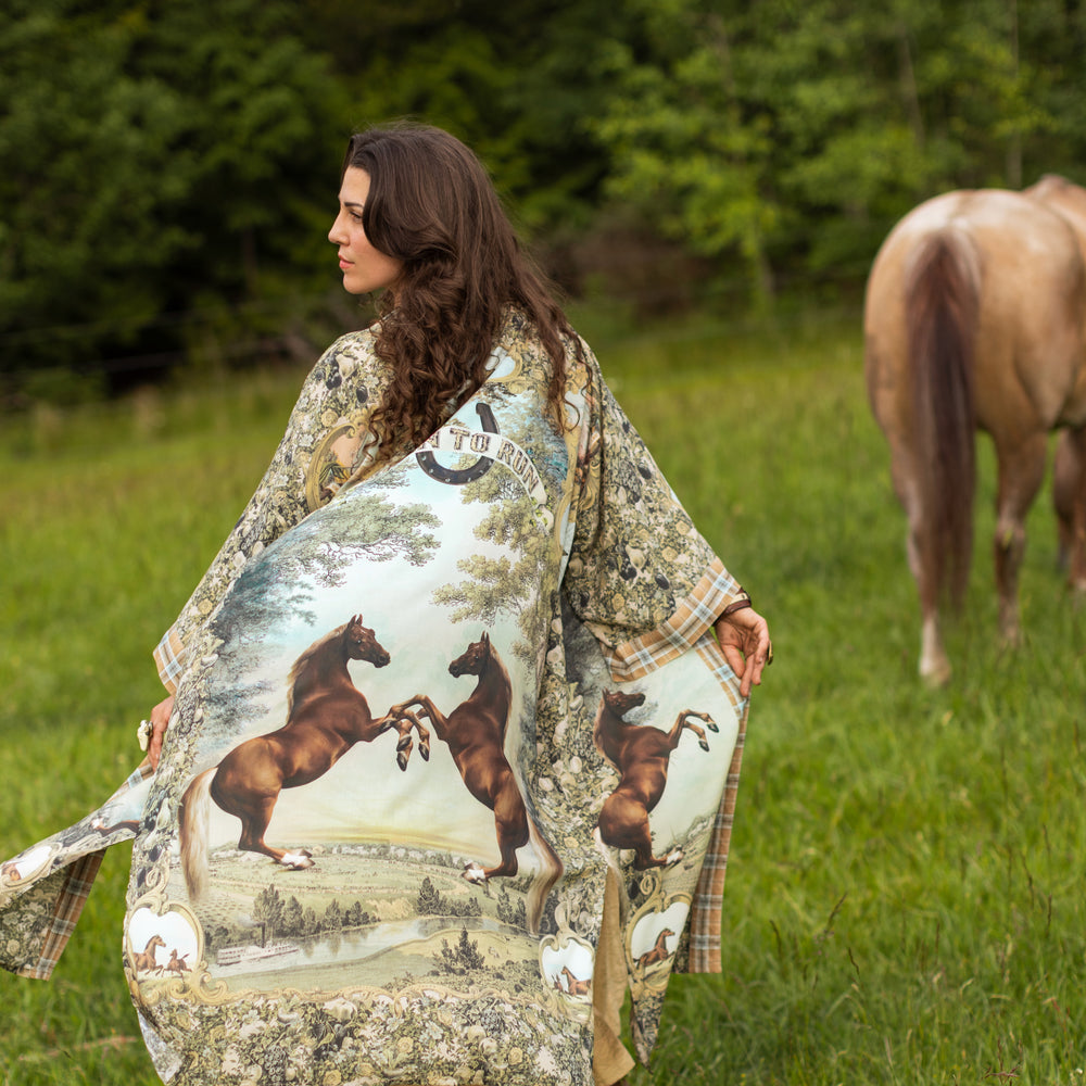 
                  
                    Model wearing a bamboo-viscose kimono duster robe made for everyday adventures with a whimsical print celebrating one's unbridled spirit of adventure - Market of Stars
                  
                