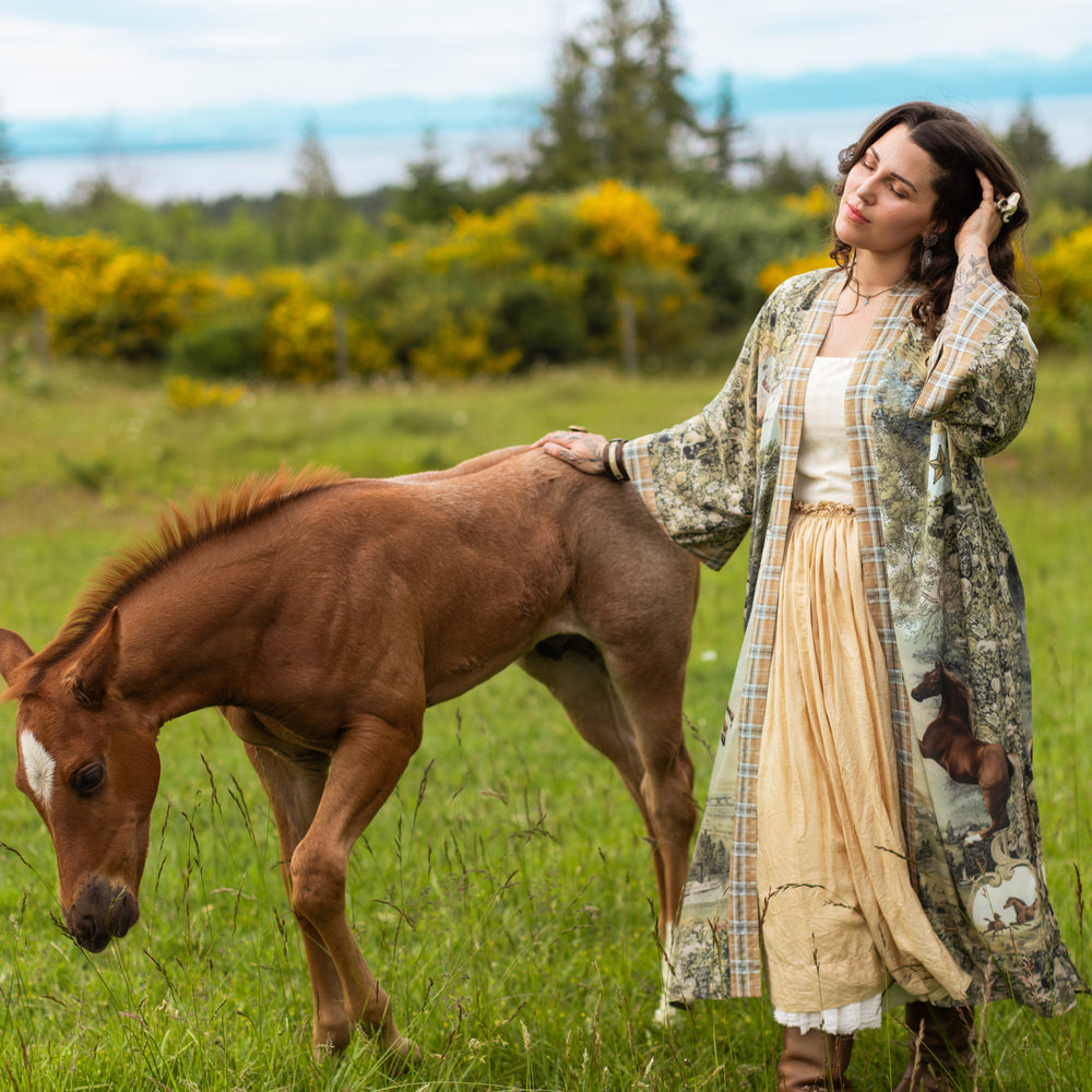 
                  
                    Model wearing a bamboo-viscose kimono duster robe made for everyday adventures with a whimsical print celebrating one's unbridled spirit of adventure - Market of Stars
                  
                