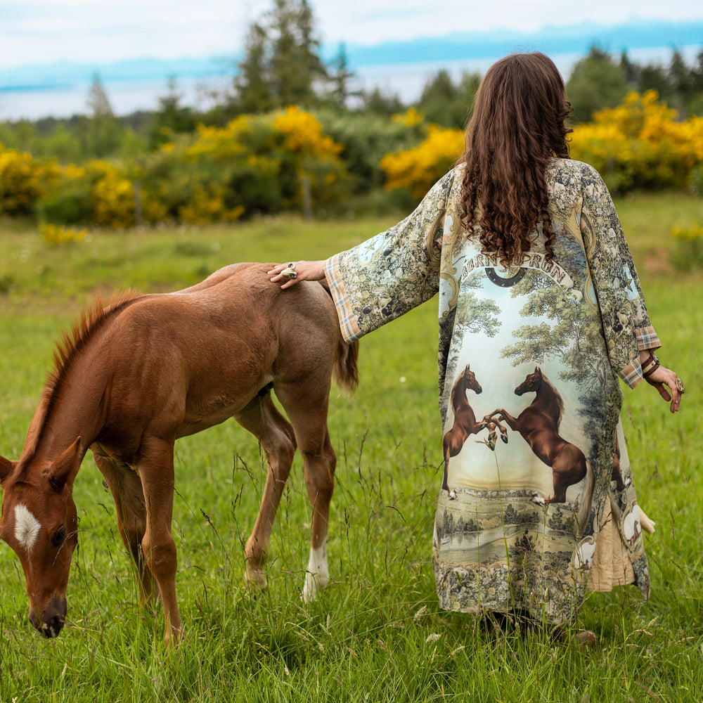 
                  
                    Model wearing a bamboo-viscose kimono duster robe made for everyday adventures with a whimsical print celebrating one's unbridled spirit of adventure - Market of Stars
                  
                