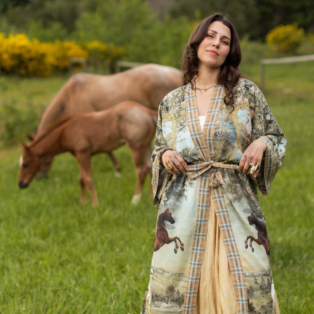 
                  
                    Model wearing a bamboo-viscose kimono duster robe made for everyday adventures with a whimsical print celebrating one's unbridled spirit of adventure - Market of Stars
                  
                