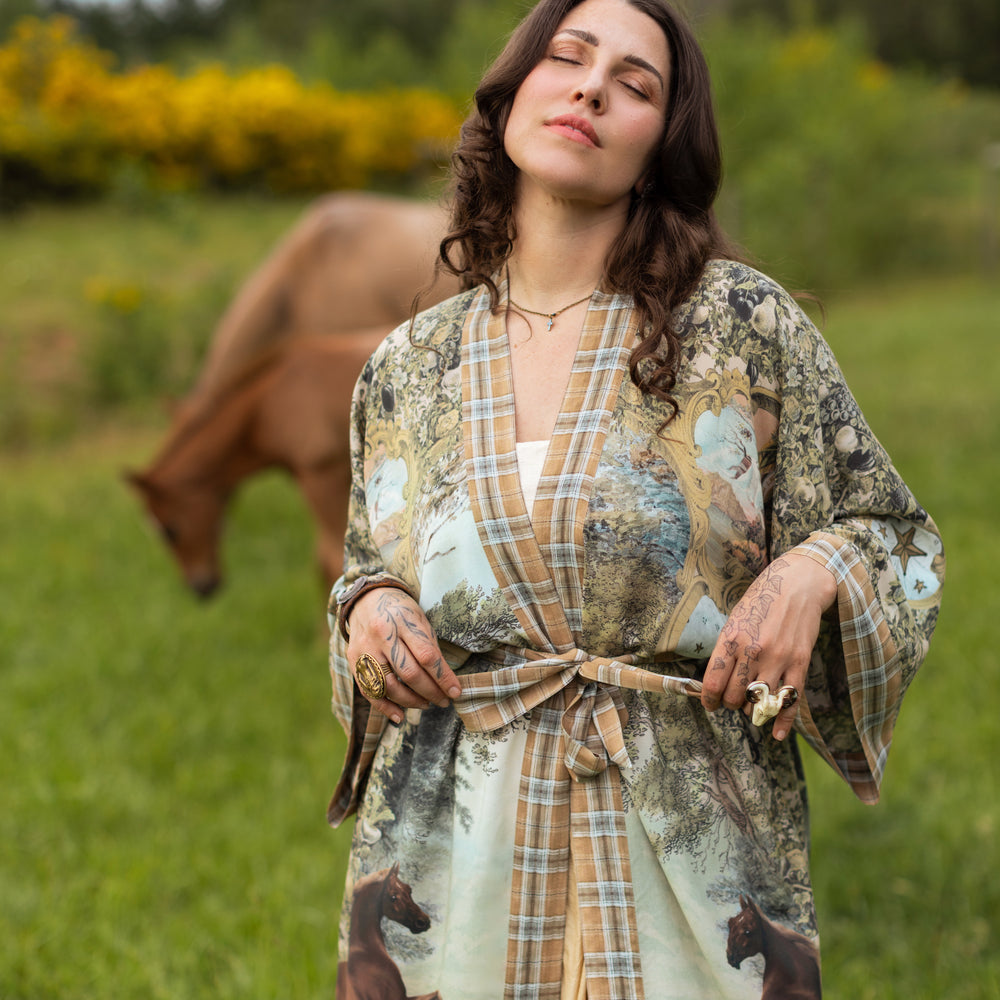 
                  
                    Model wearing a bamboo-viscose kimono duster robe made for everyday adventures with a whimsical print celebrating one's unbridled spirit of adventure - Market of Stars
                  
                