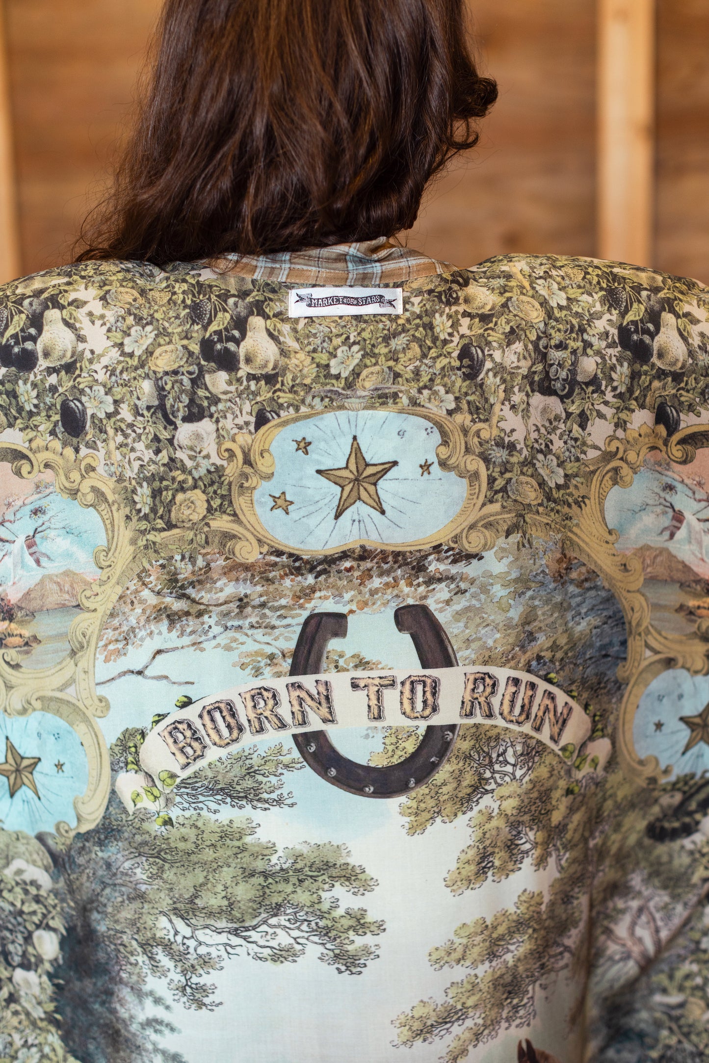 Model wearing a bamboo-viscose kimono duster robe made for everyday adventures with a whimsical print celebrating one's unbridled spirit of adventure - Market of Stars