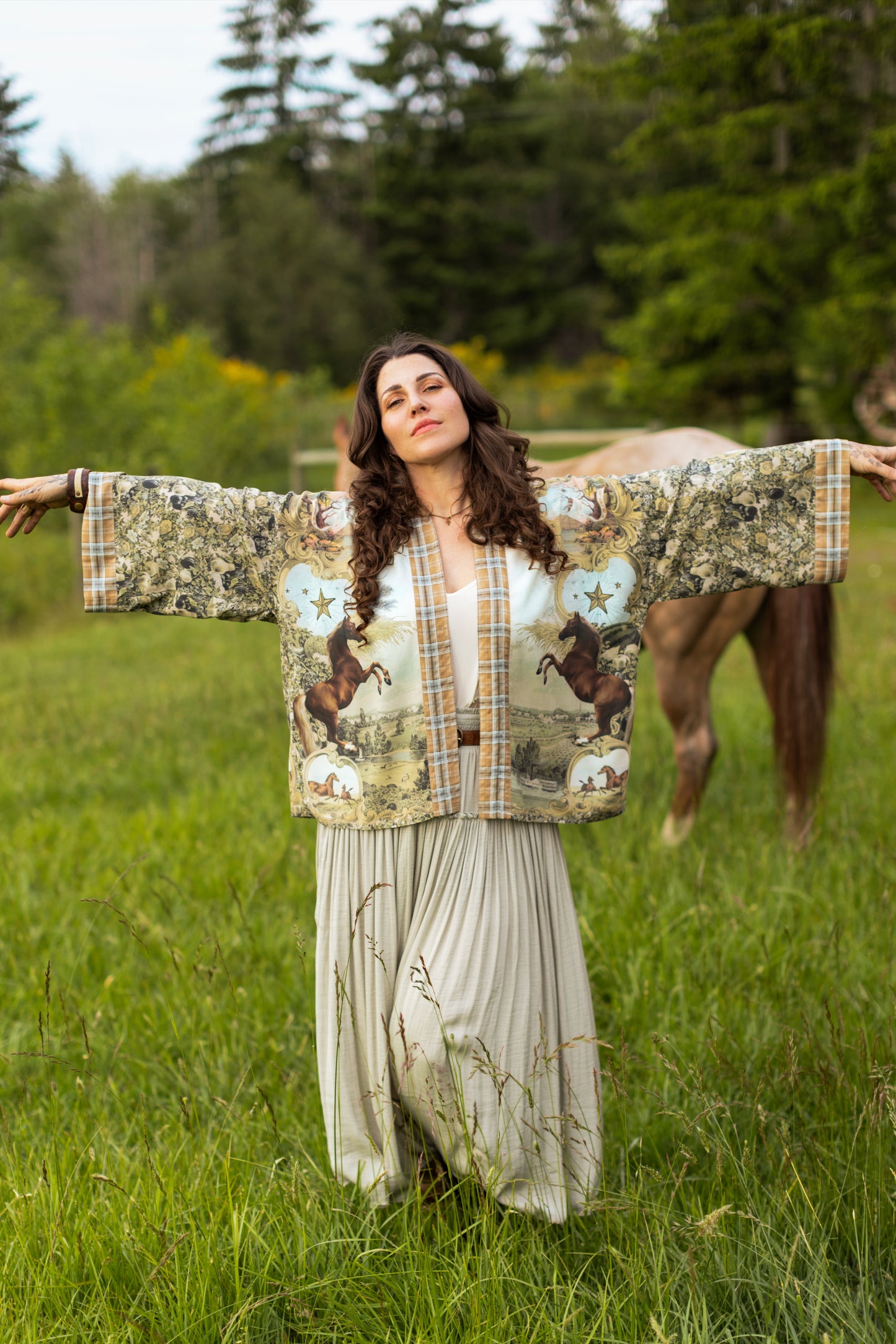 Model wearing a bamboo-viscose cropped kimono duster made for everyday adventures with a whimsical print celebrating one's unbridled spirit of adventure - Market of Stars