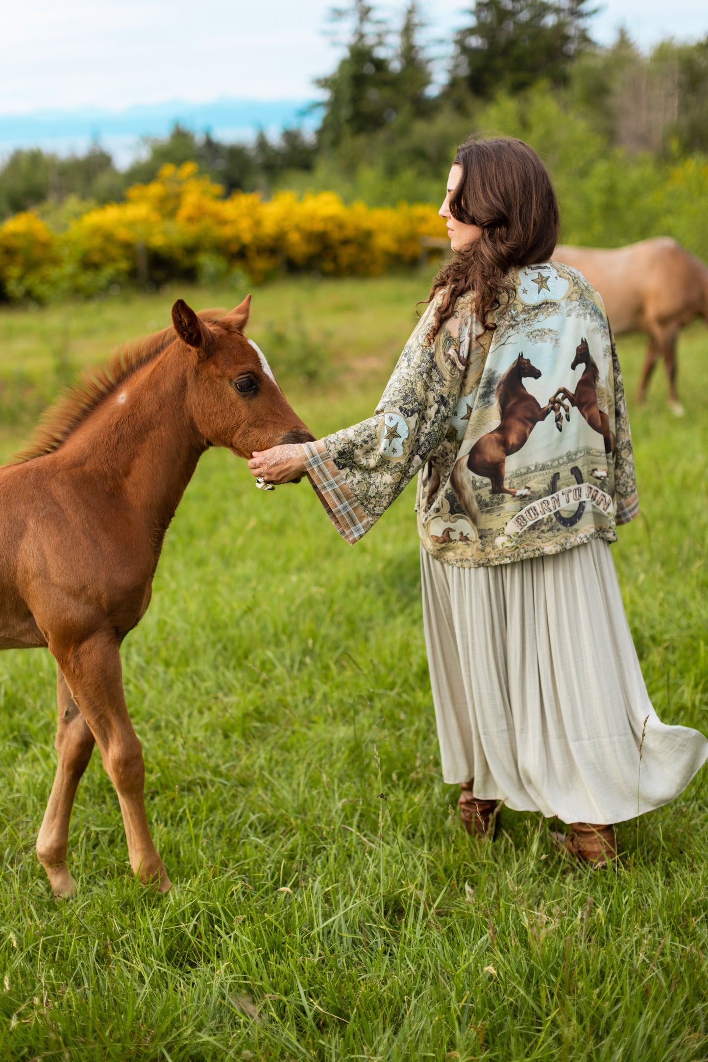 Model wearing a bamboo-viscose cropped kimono duster made for everyday adventures with a whimsical print celebrating one's unbridled spirit of adventure - Market of Stars