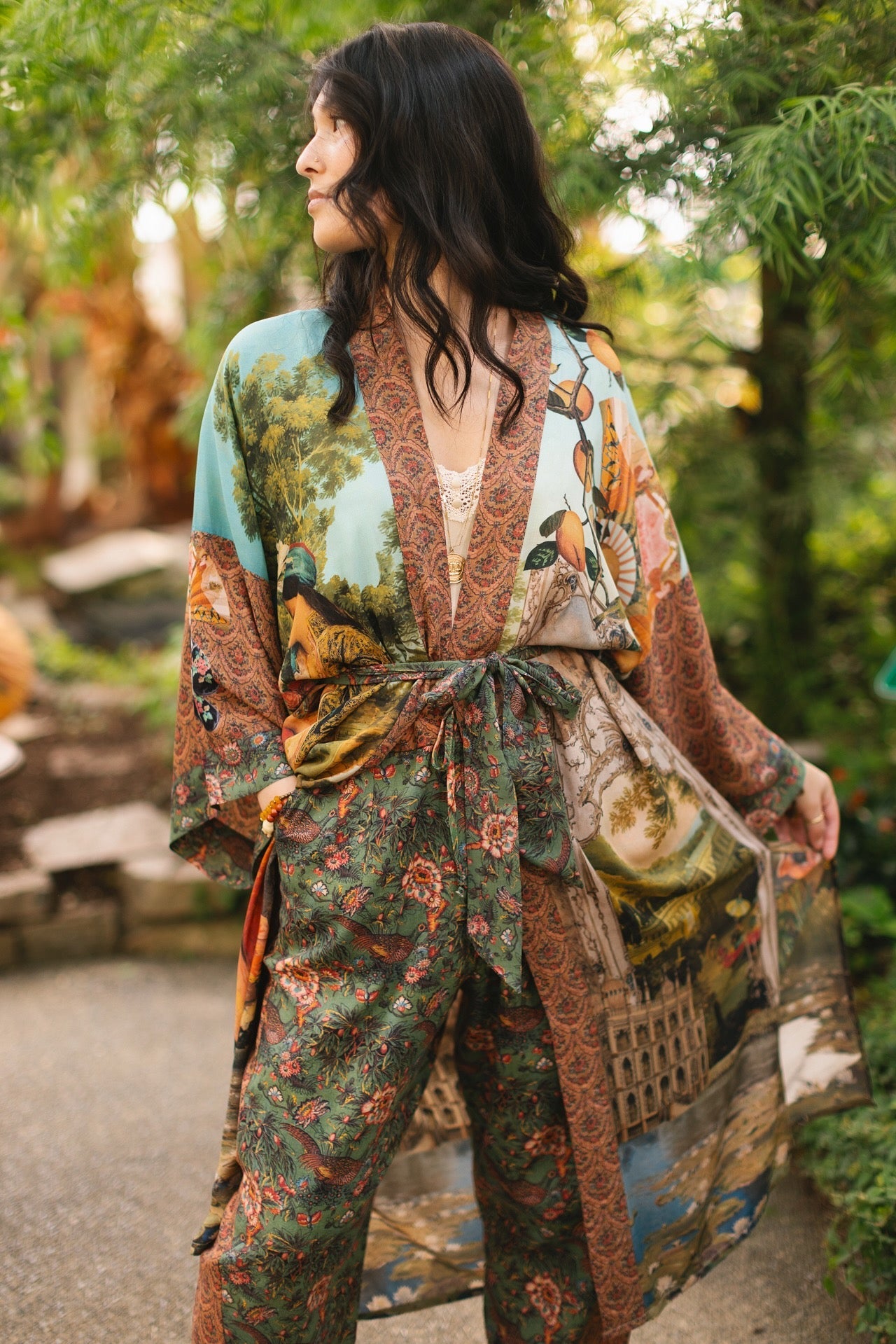Model wearing Peace, Wine & Sunshine Bohéme Slip Dress featuring botanical collages and playful peace, wine and sunshine lettering on the hem – Market of Stars.